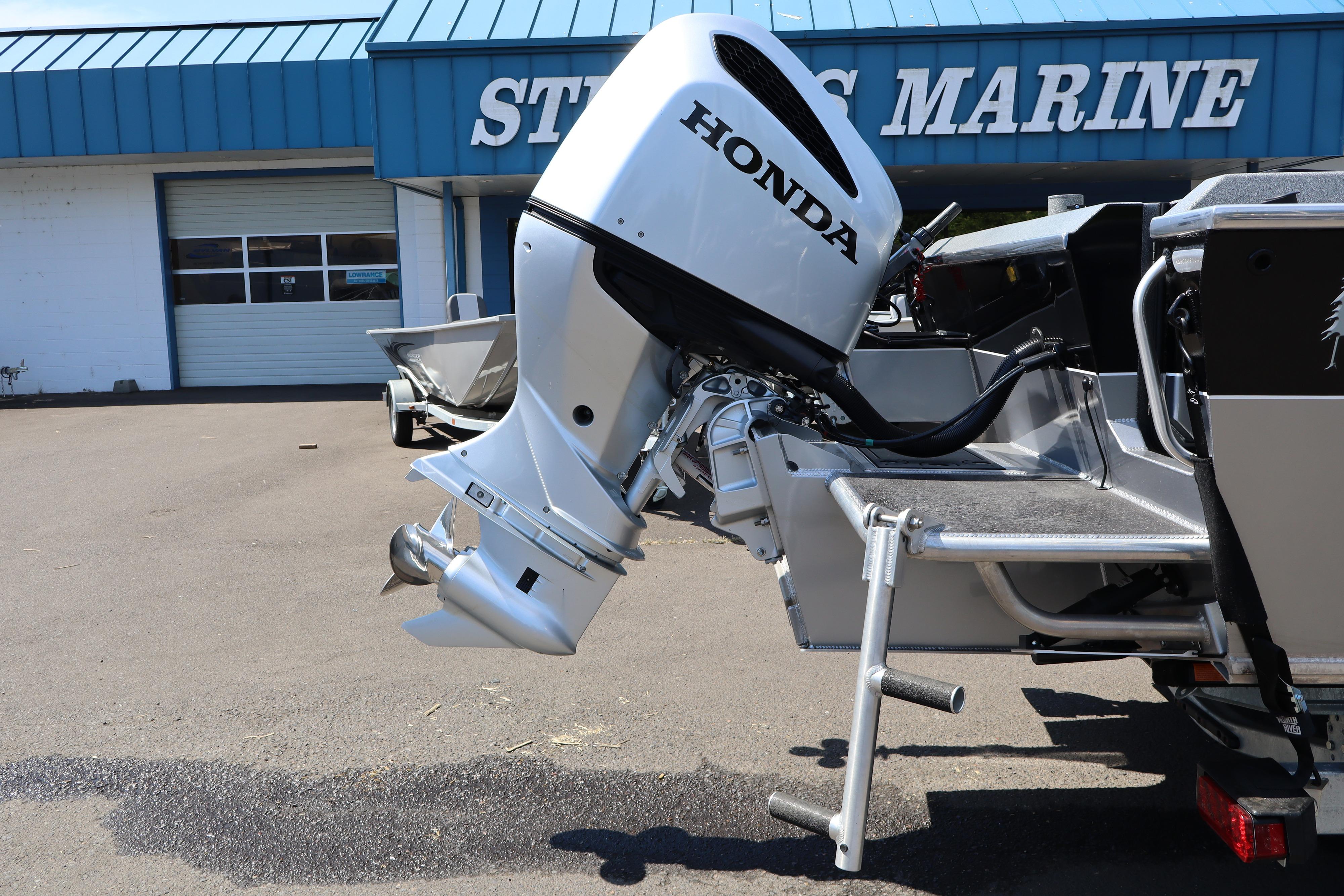 2025 NorthRiver SEAHAWK with Honda outboard motor at a marine dealership.