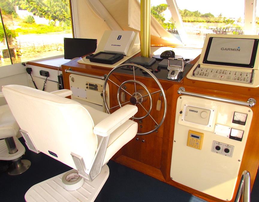 Interior helm of 1972 Hargrave 67 Motor Yacht with modern navigation equipment.