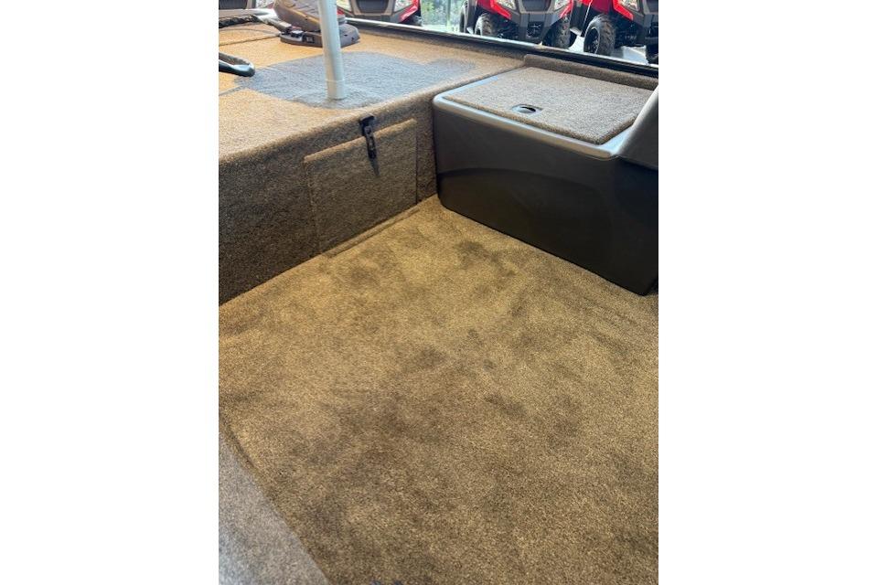 2026 Tracker Bass Tracker Classic XL interior with carpeted flooring and storage compartment.