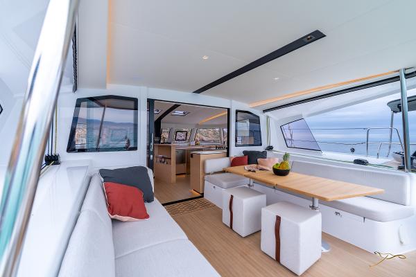 Luxurious interior of 2025 Nautitech 44 Open catamaran with modern seating and ocean view.