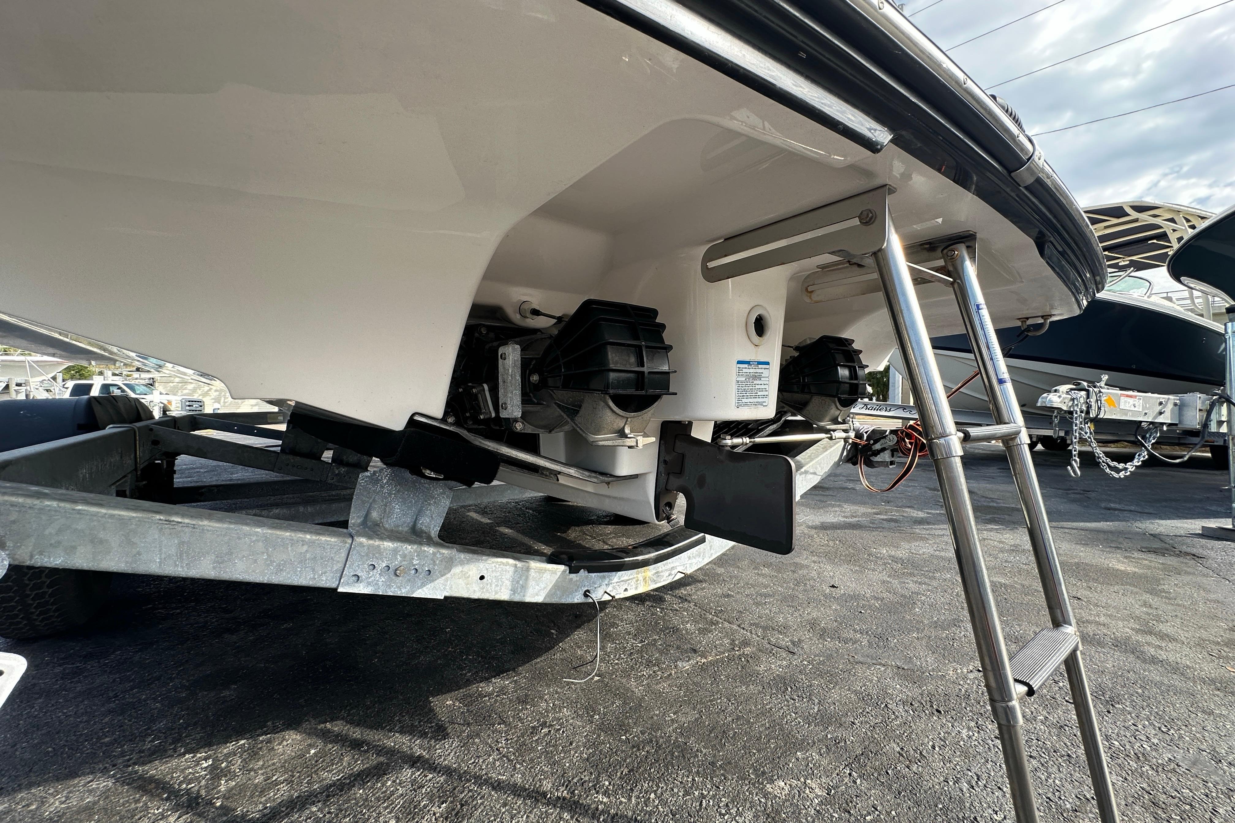 2017 Yamaha Boats 242 Limited S on trailer, showing rear view with ladder.