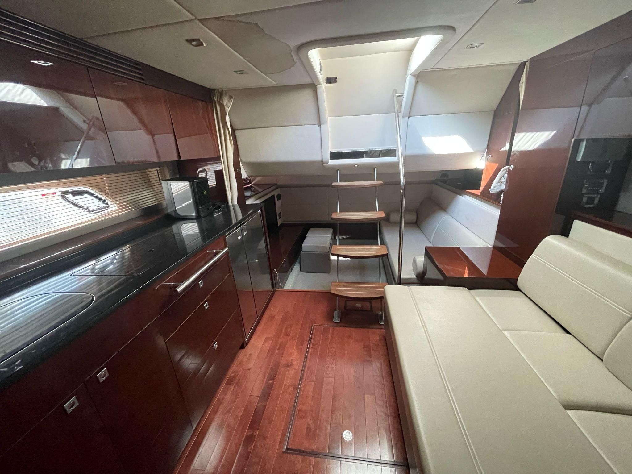 Interior of a 2010 Sea Ray 450 yacht with modern kitchen.