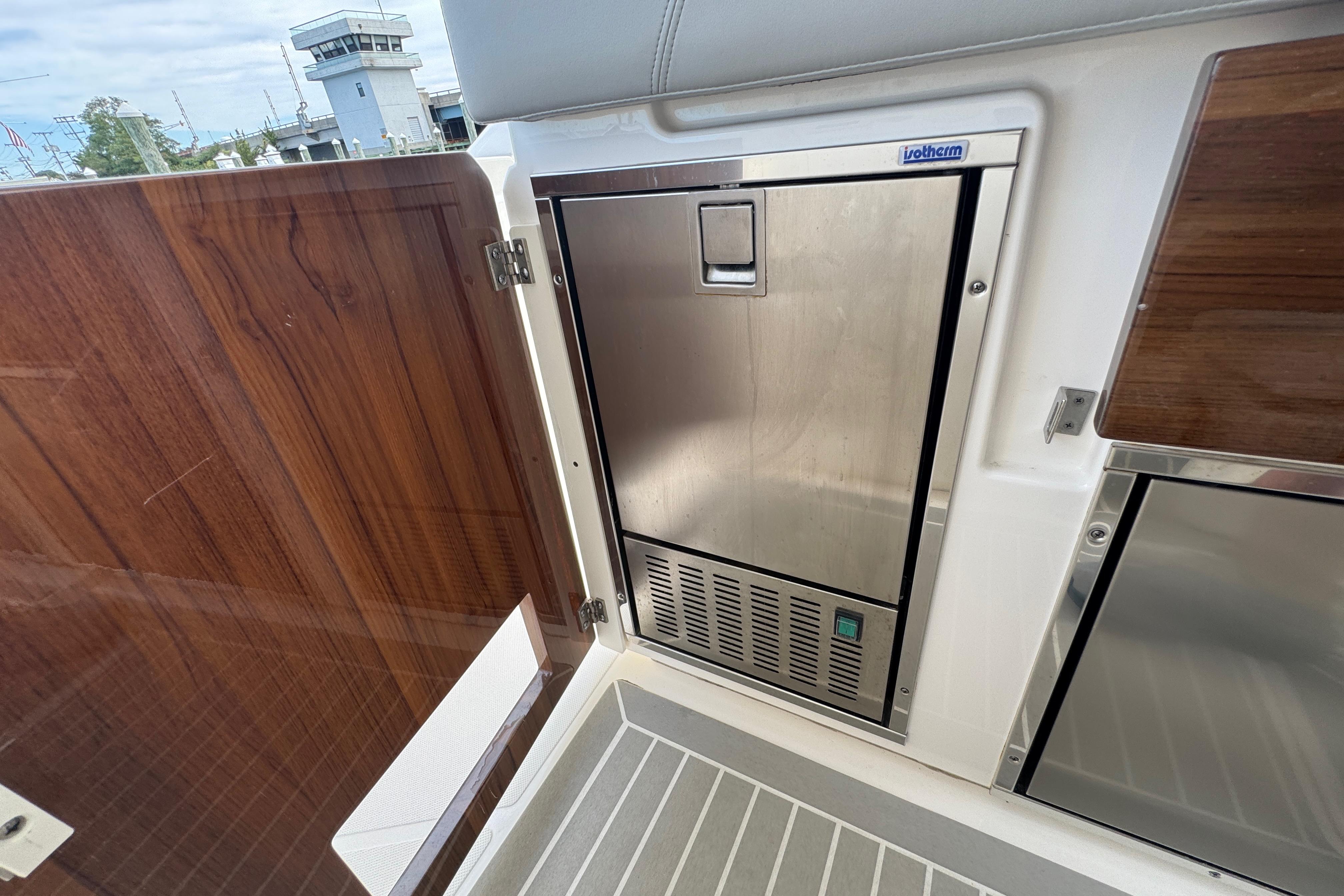 2023 Tiara Yachts 43 LS interior with stainless steel appliance and wooden paneling.