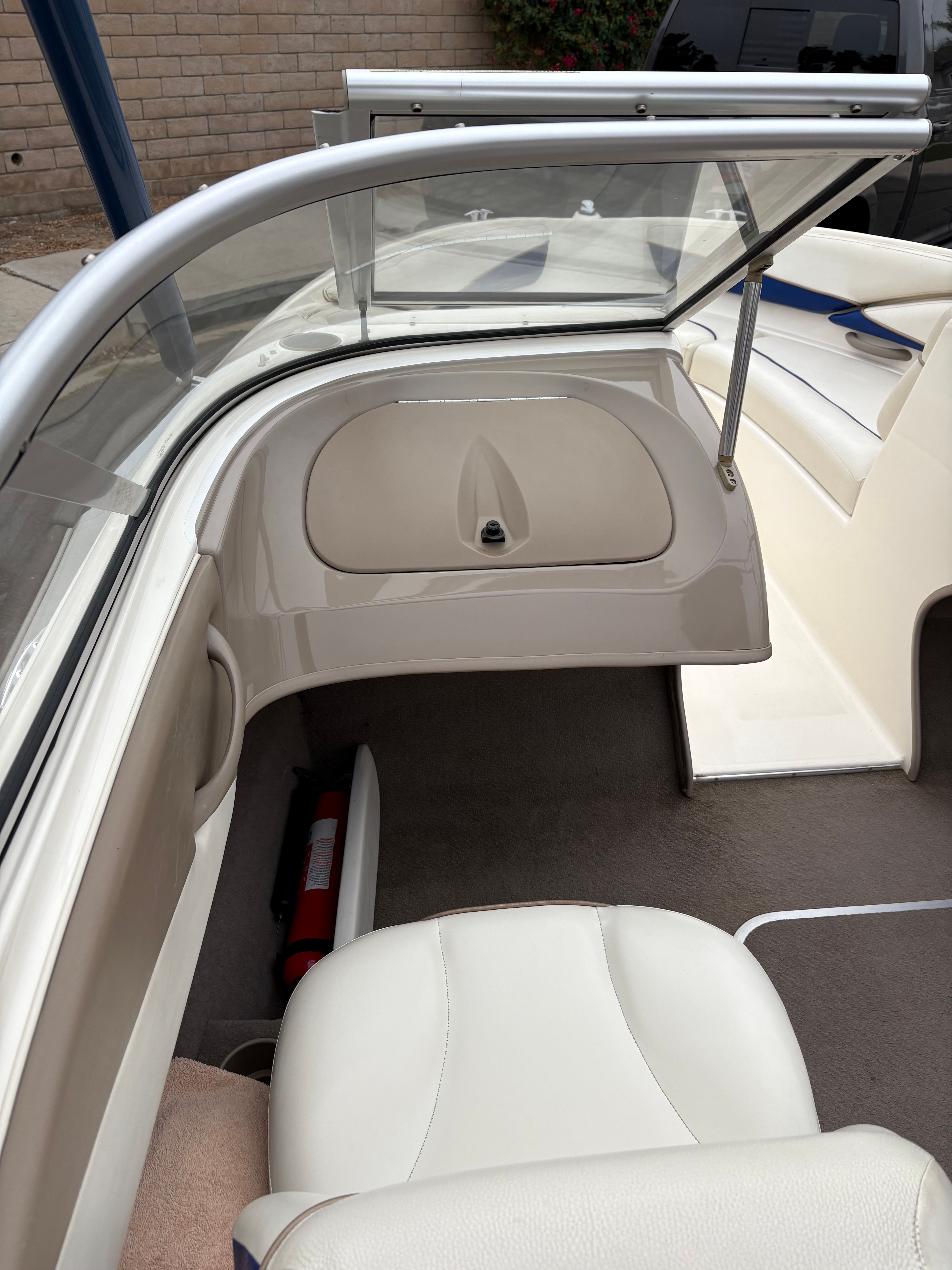 2003 Bayliner CAPRI 205 boat interior with seating and windshield.