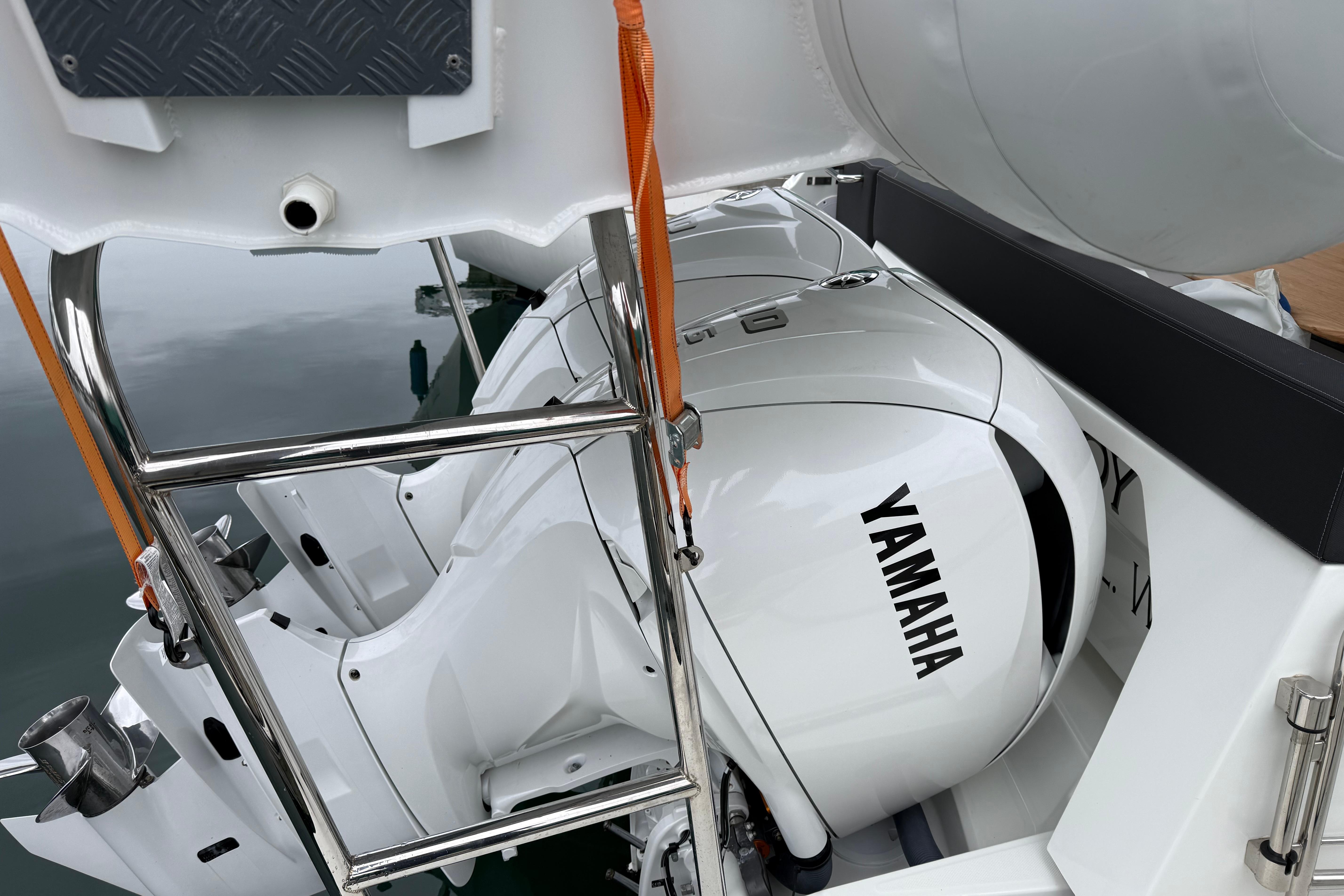 2023 Jeanneau NC 1095 boat with Yamaha outboard motor, featuring a sleek design.