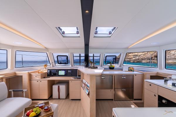 Luxurious interior of 2025 Nautitech 44 Open catamaran with modern kitchen and panoramic windows.