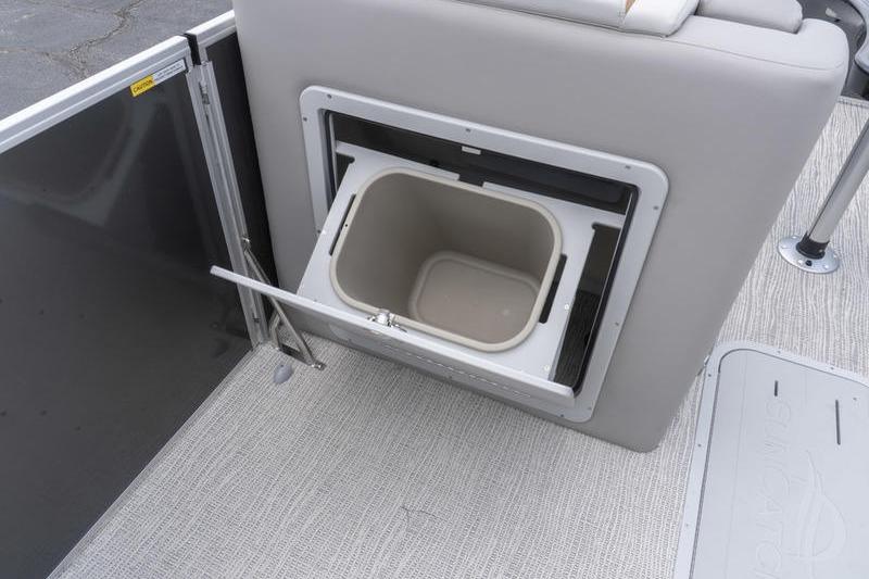 Built-in cooler compartment on 2026 SunCatcher Elite 326 SS boat, featuring sleek design and functionality.