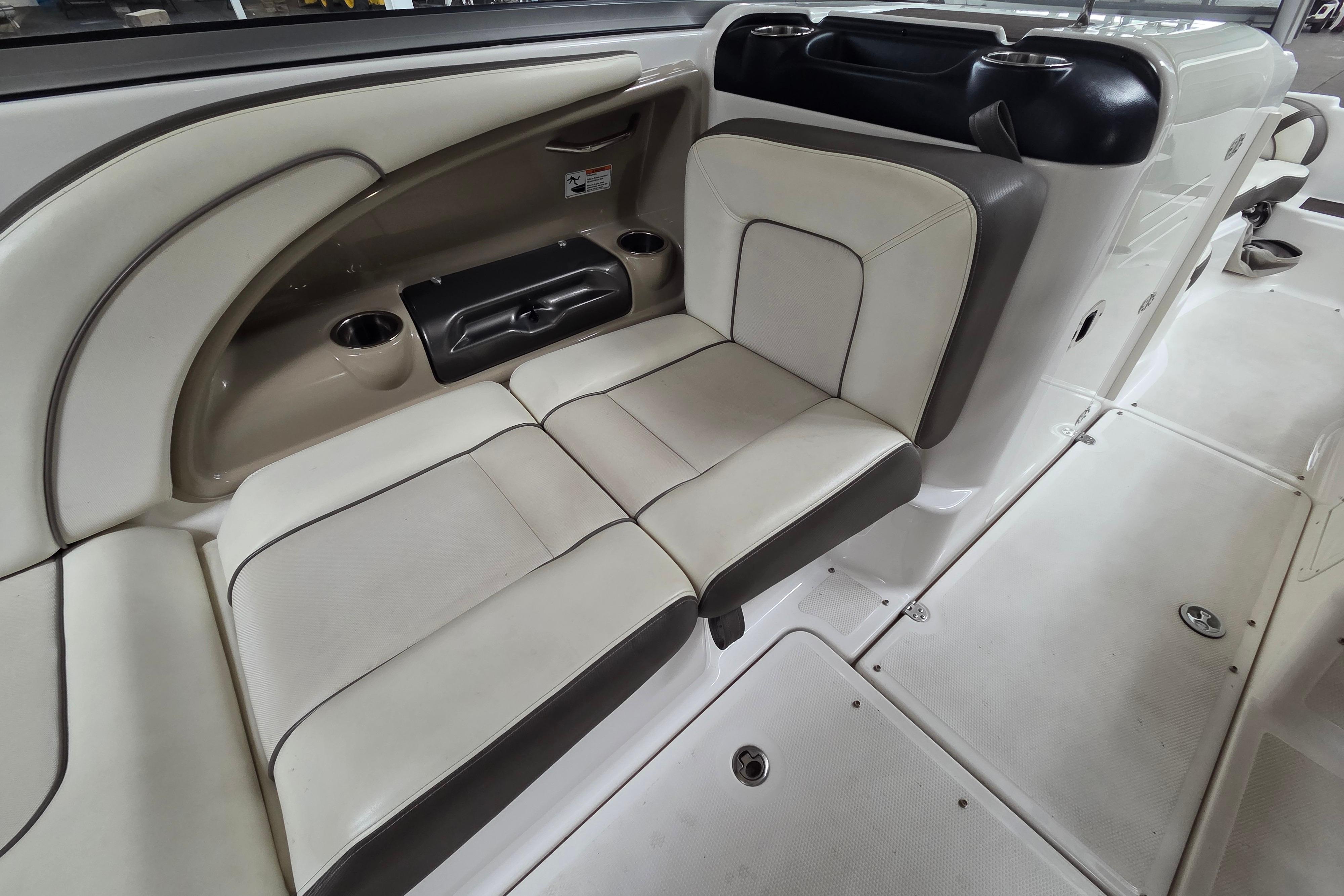 Interior seating of 2013 Yamaha 242 Limited S boat, featuring beige and brown upholstery.