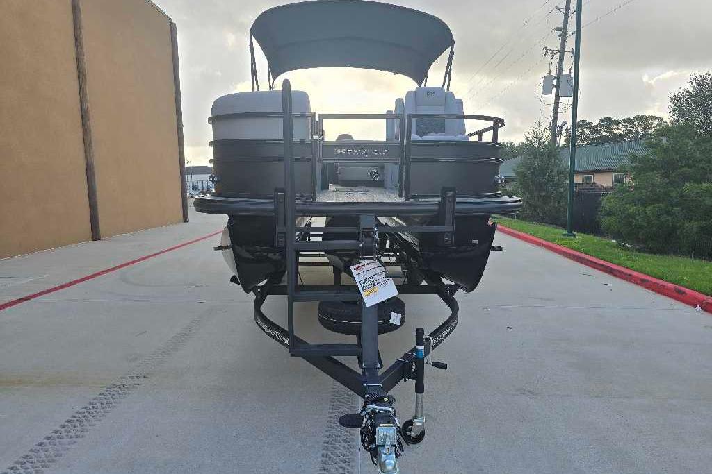 2026 Ranger 223FC boat on trailer, parked outdoors, front view.