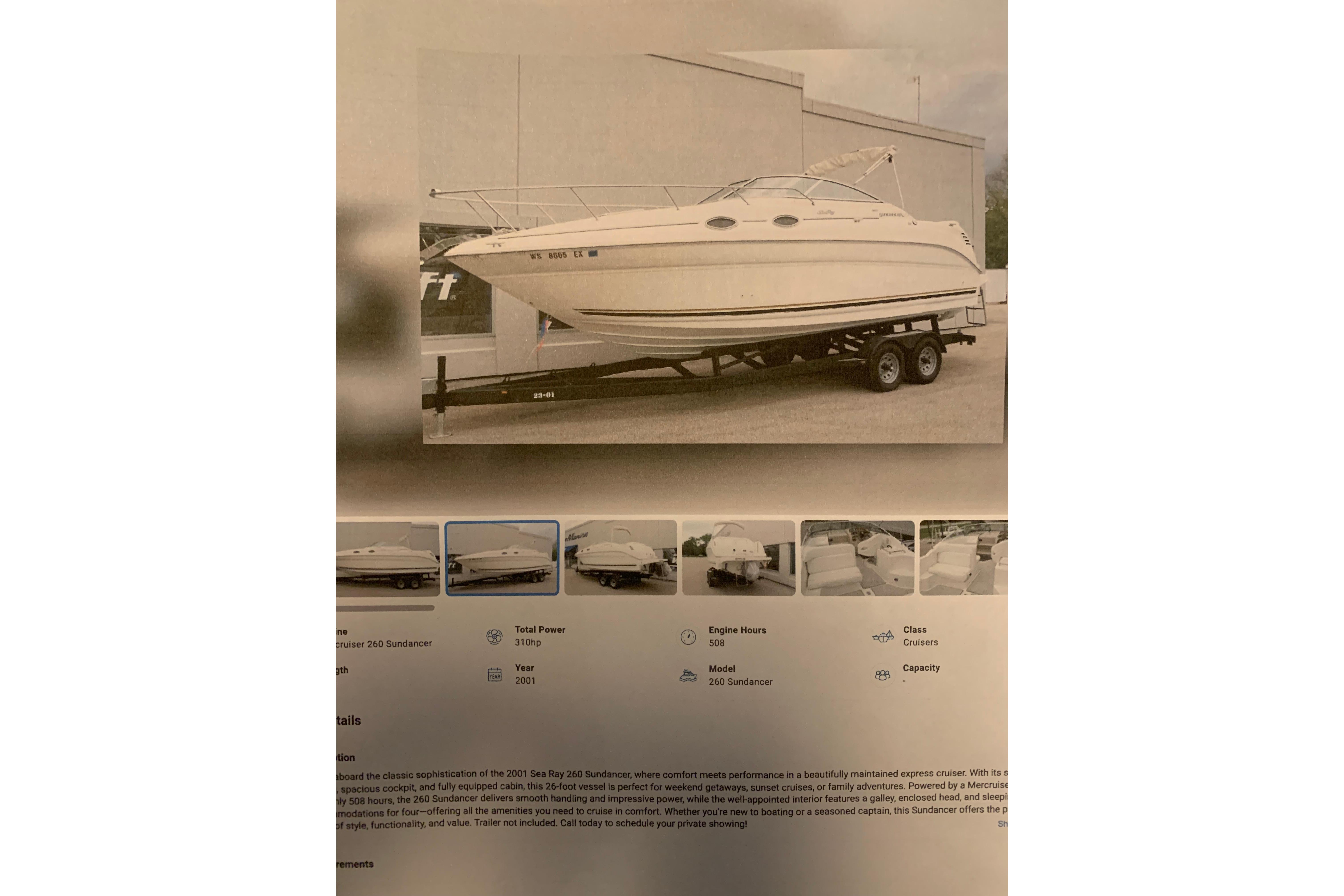 2001 Sea Ray Sundancer 260 boat on trailer, displayed outdoors with detailed specifications below.