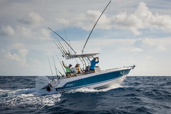 Manufacturer Provided Image: 2024 Boston Whaler 230 Outrage fishing boat on the ocean.