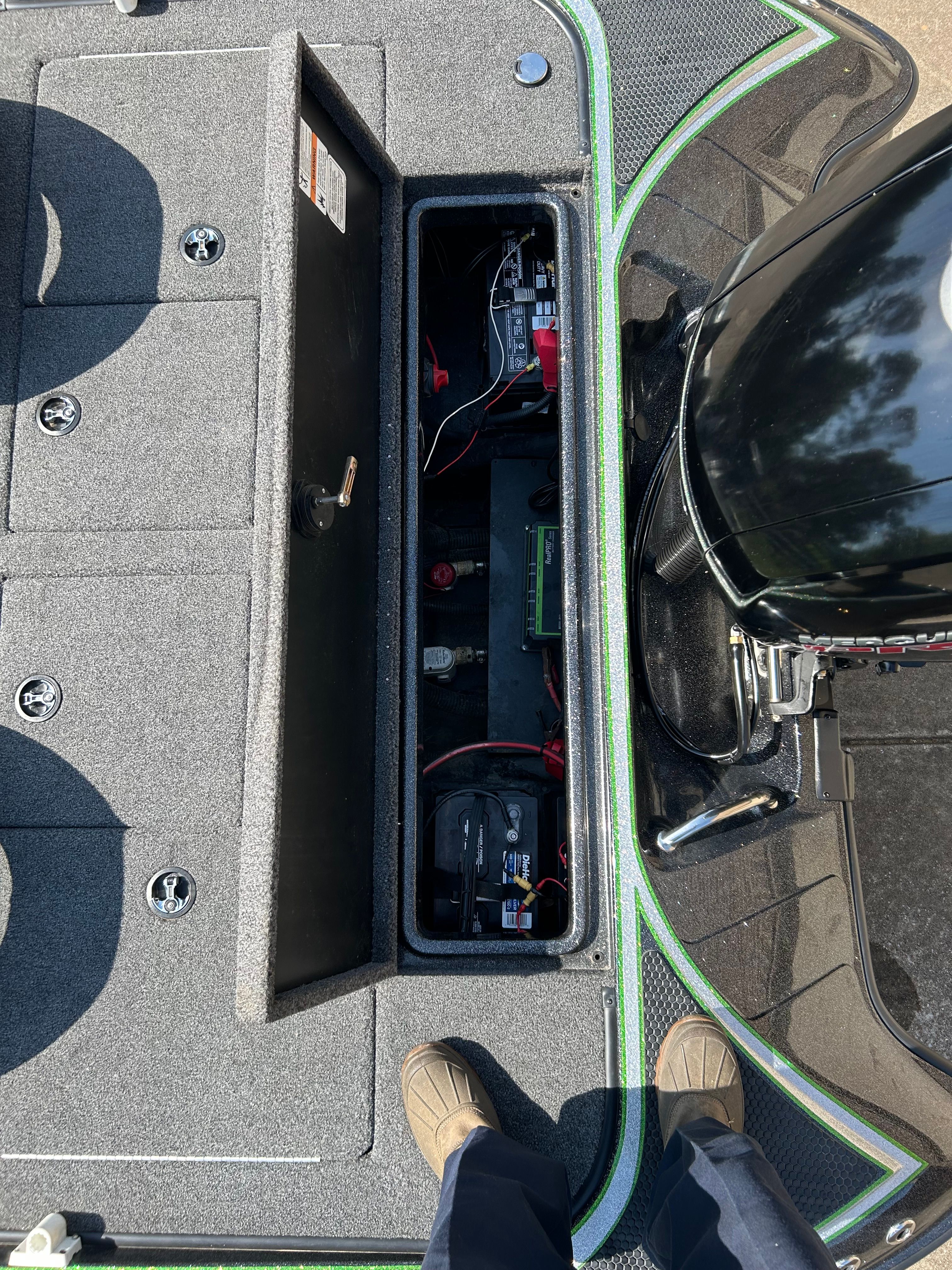 A 2020 Trident 189 TRX with an open battery compartment and motor in the background.