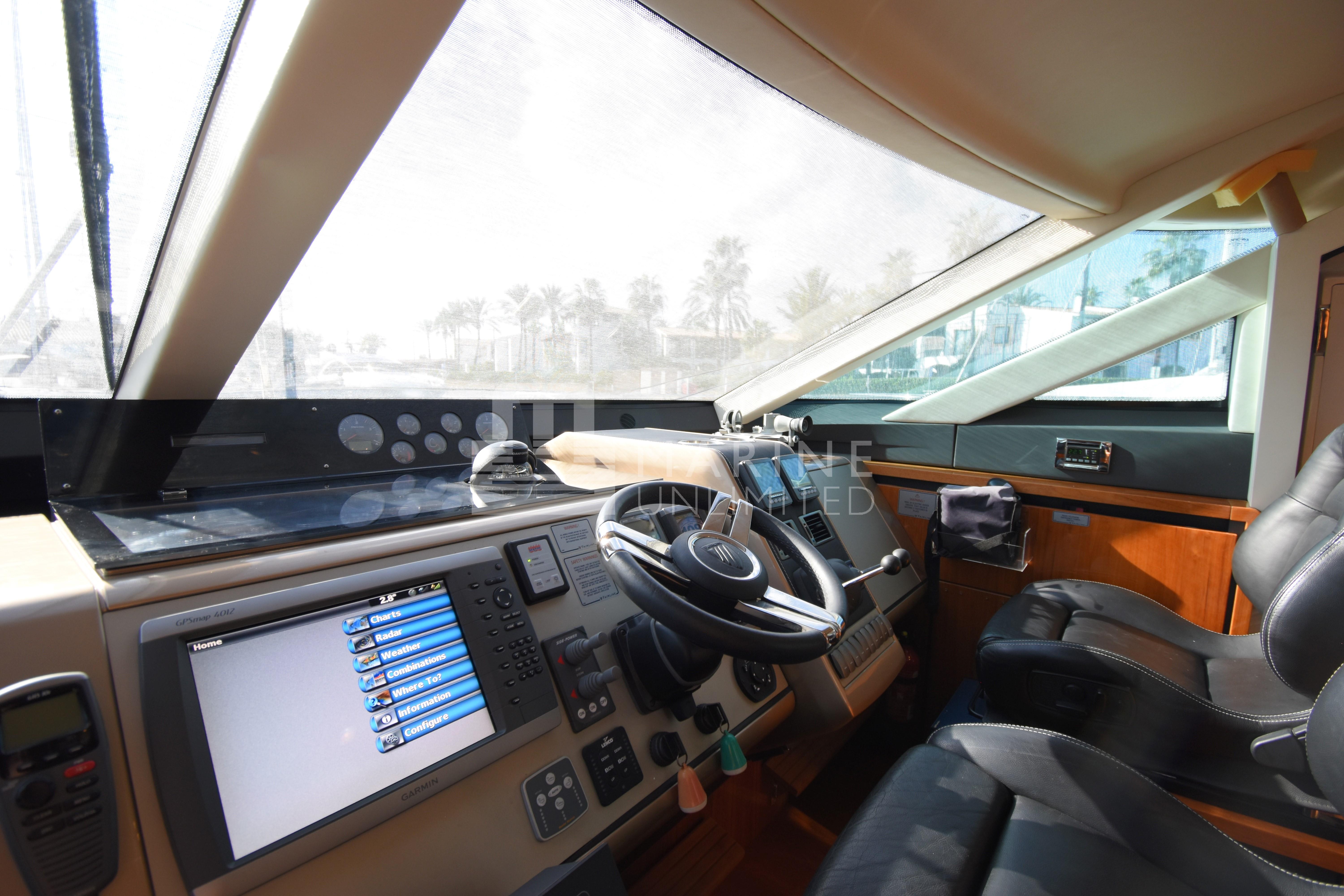 Interior cockpit of 2010 Fairline Squadron 55 yacht with modern navigation equipment.