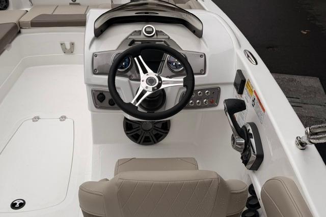 2026 Tahoe 2150 boat cockpit with steering wheel and control panel.