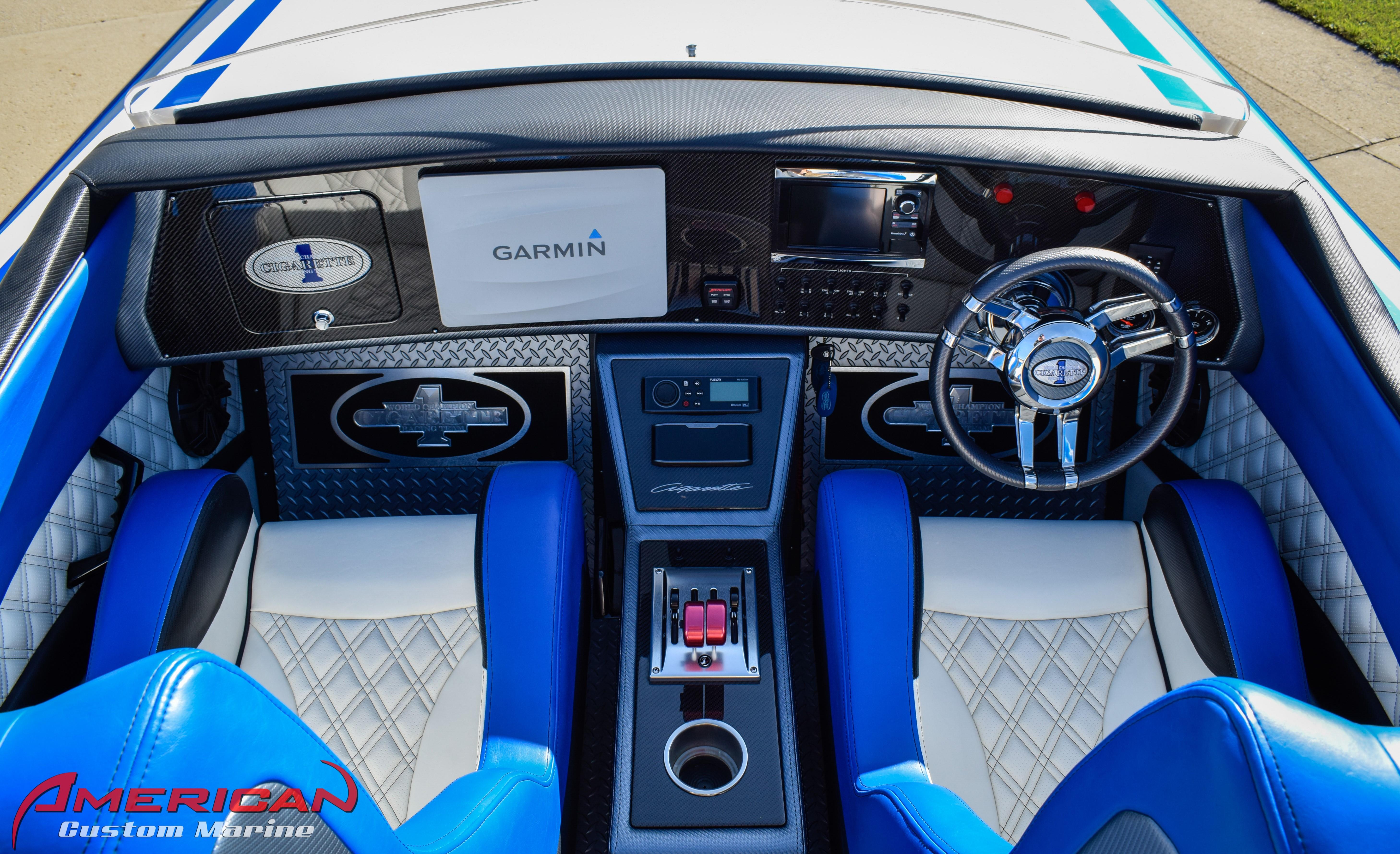 Interior of a 2005 Cigarette 45 Maximus boat with blue and white seating, Garmin navigation.