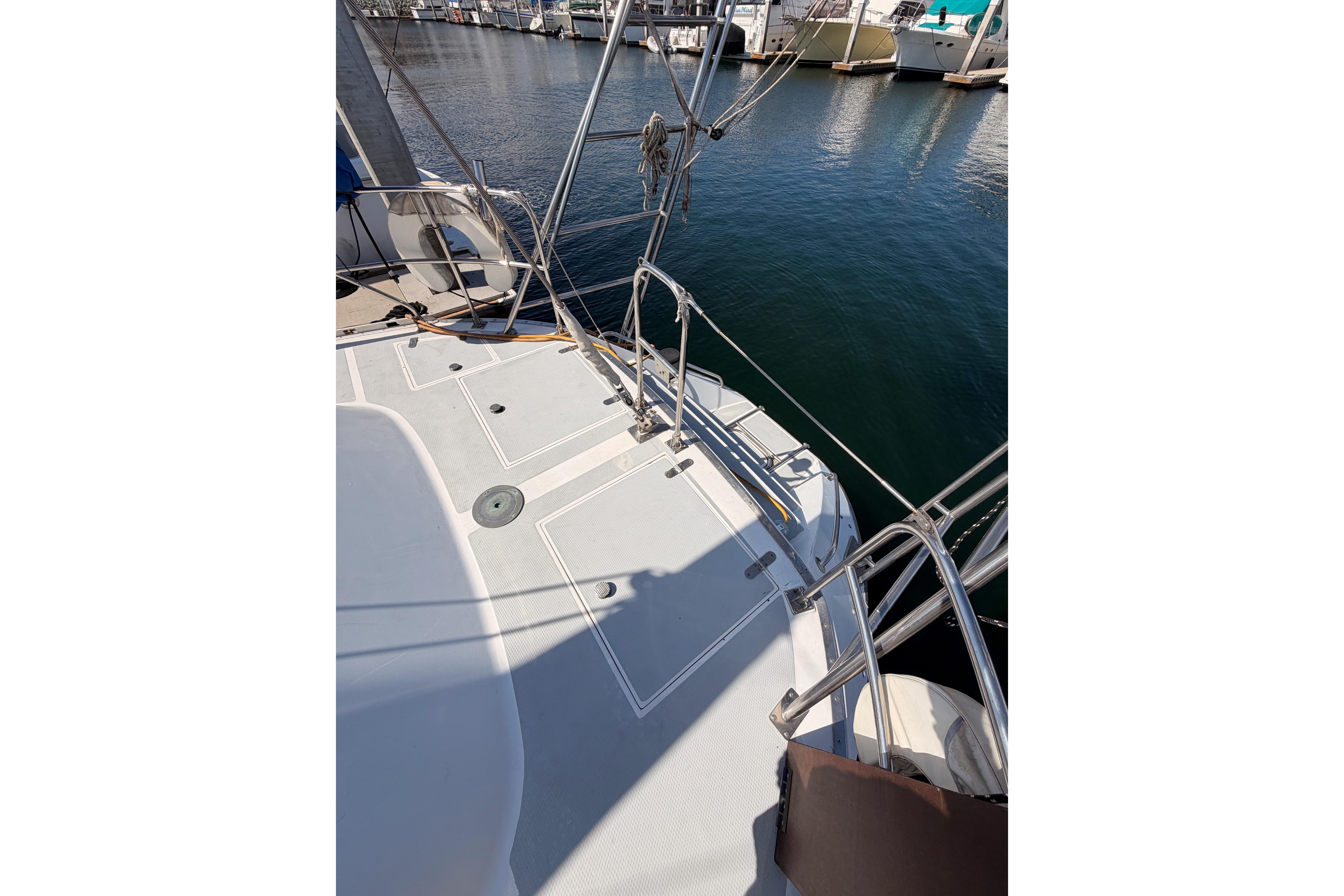 Deck view of a 1991 Hylas 51 sailboat docked at a marina.