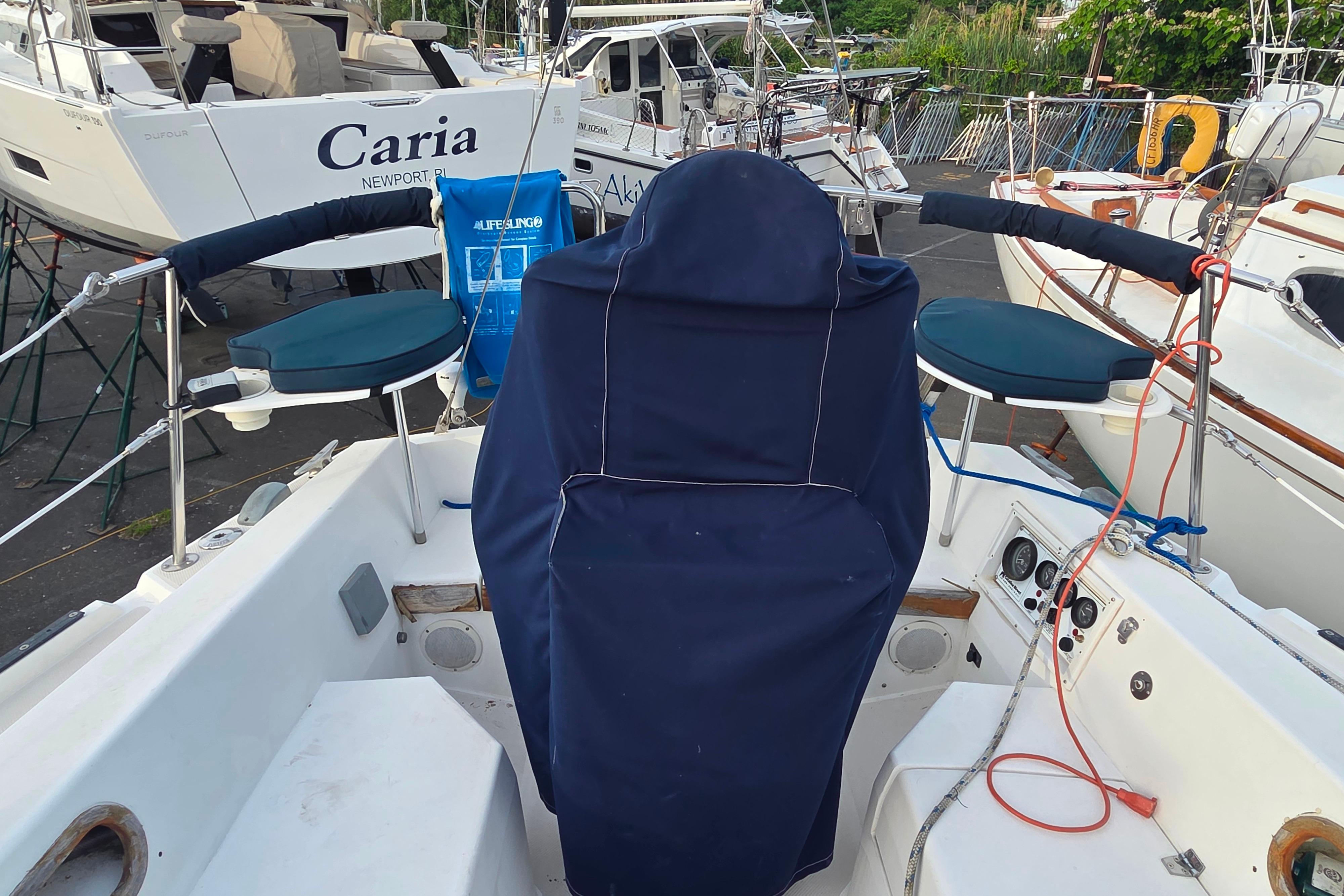 Cockpit of a 1986 Catalina 355 sailboat with covered helm and seating.