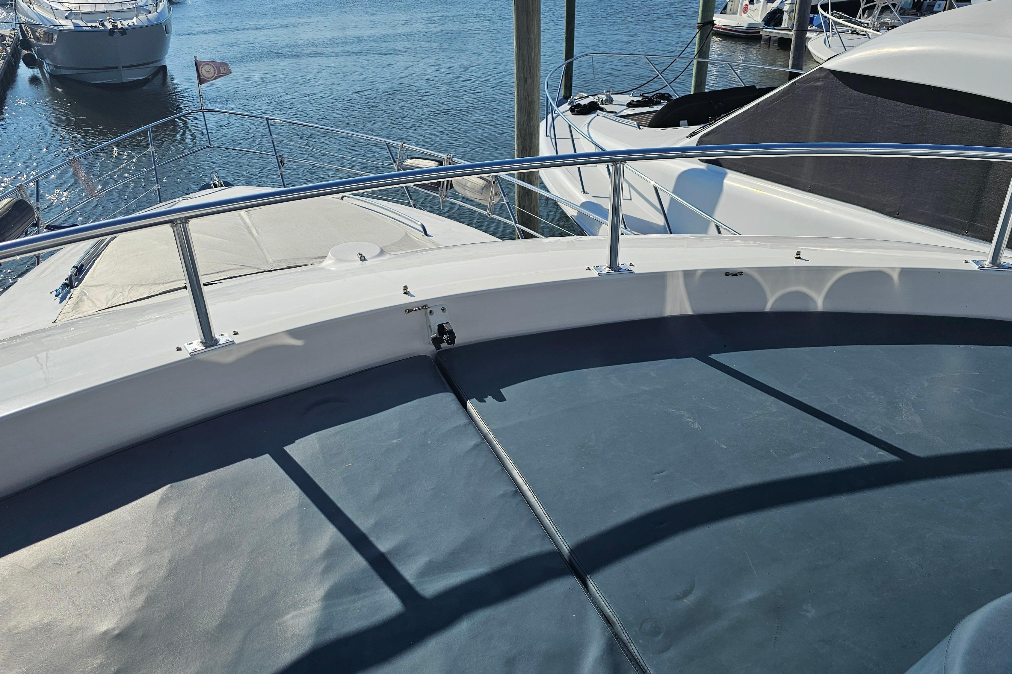 2005 Neptunus 56 Flybridge yacht deck view at marina.