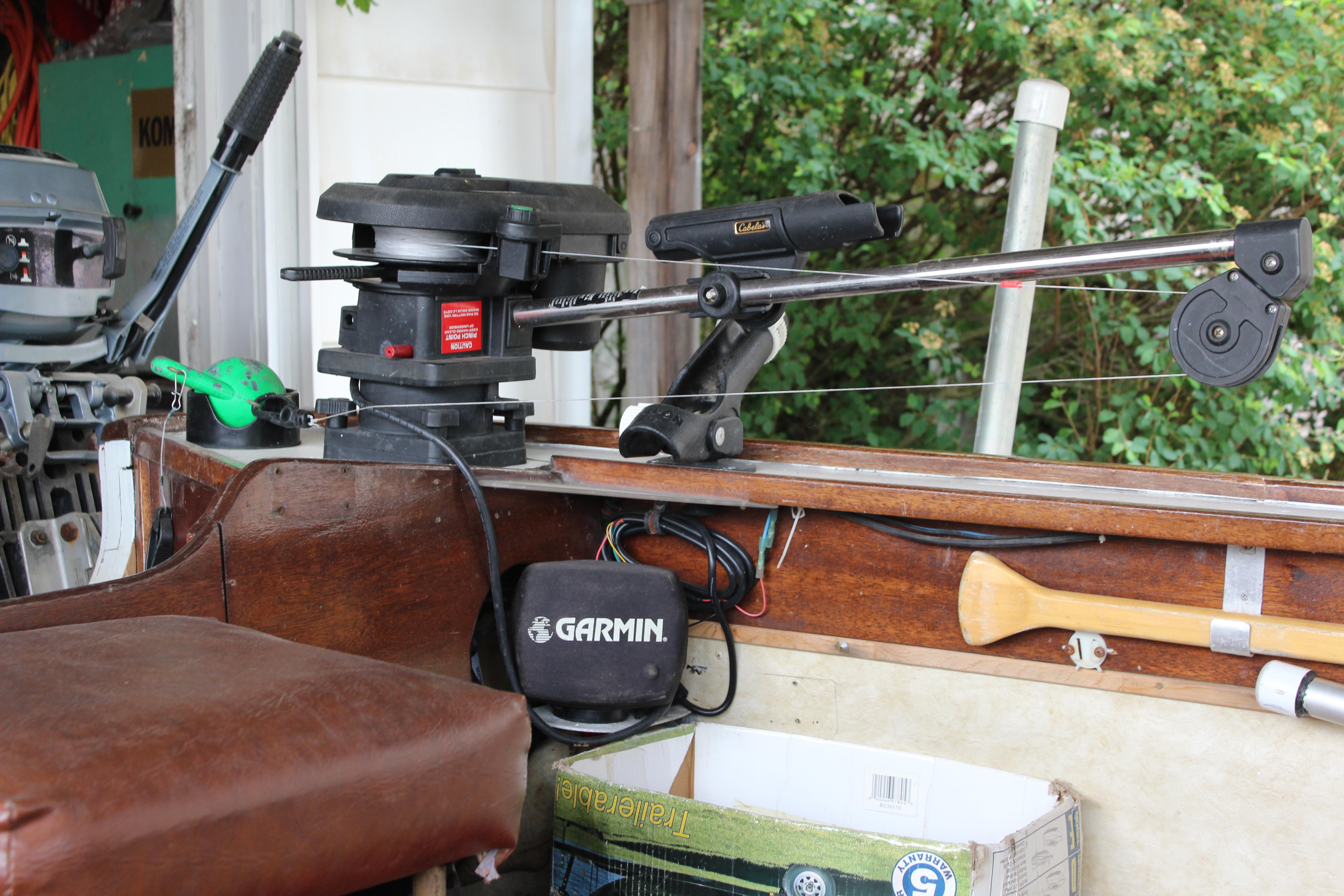 1960 Thompson Fishing boat interior with Garmin equipment and fishing gear.