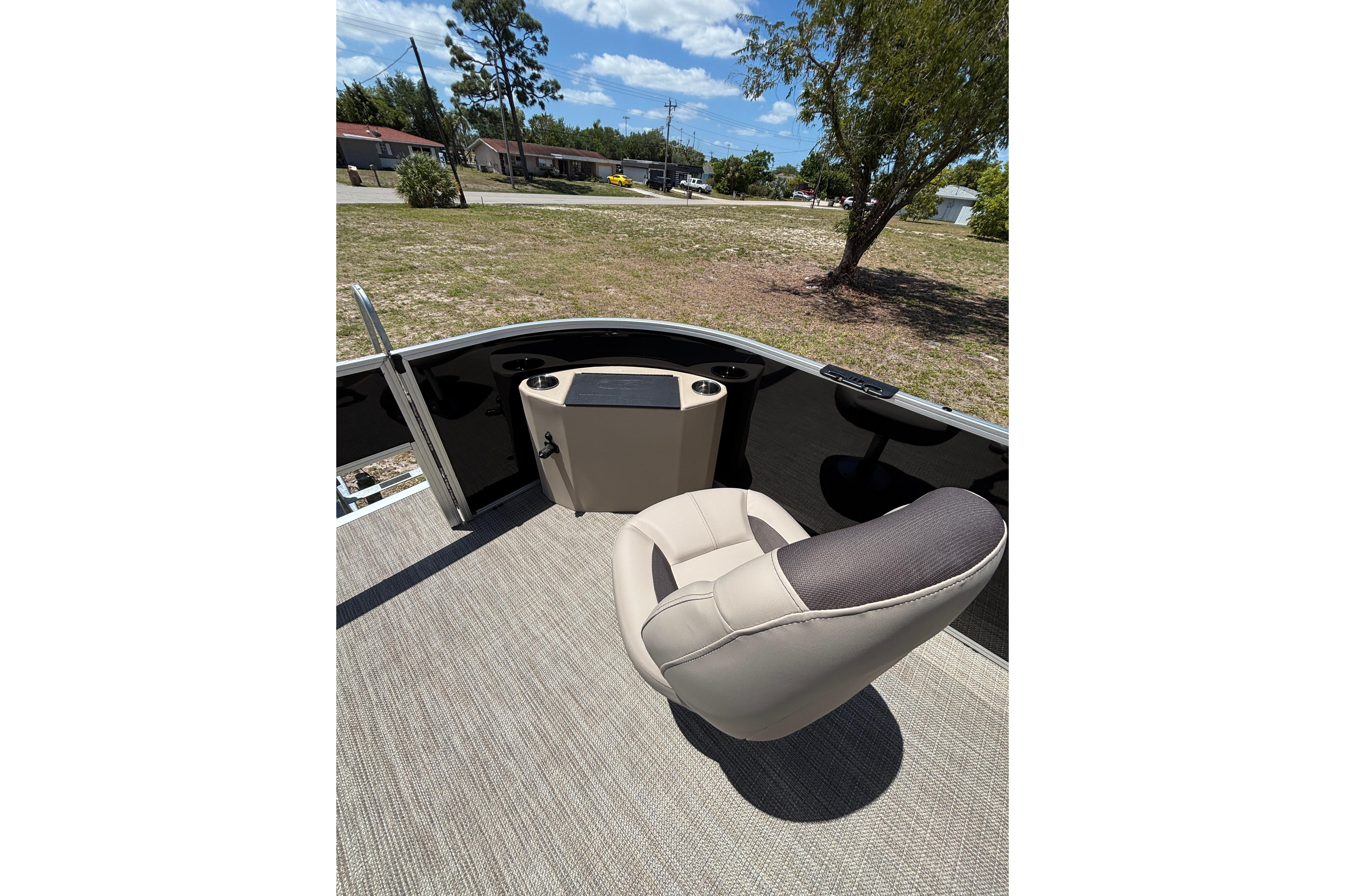 Interior of 2026 Bentley Pontoons Fish 243 4-Point with seat and helm.