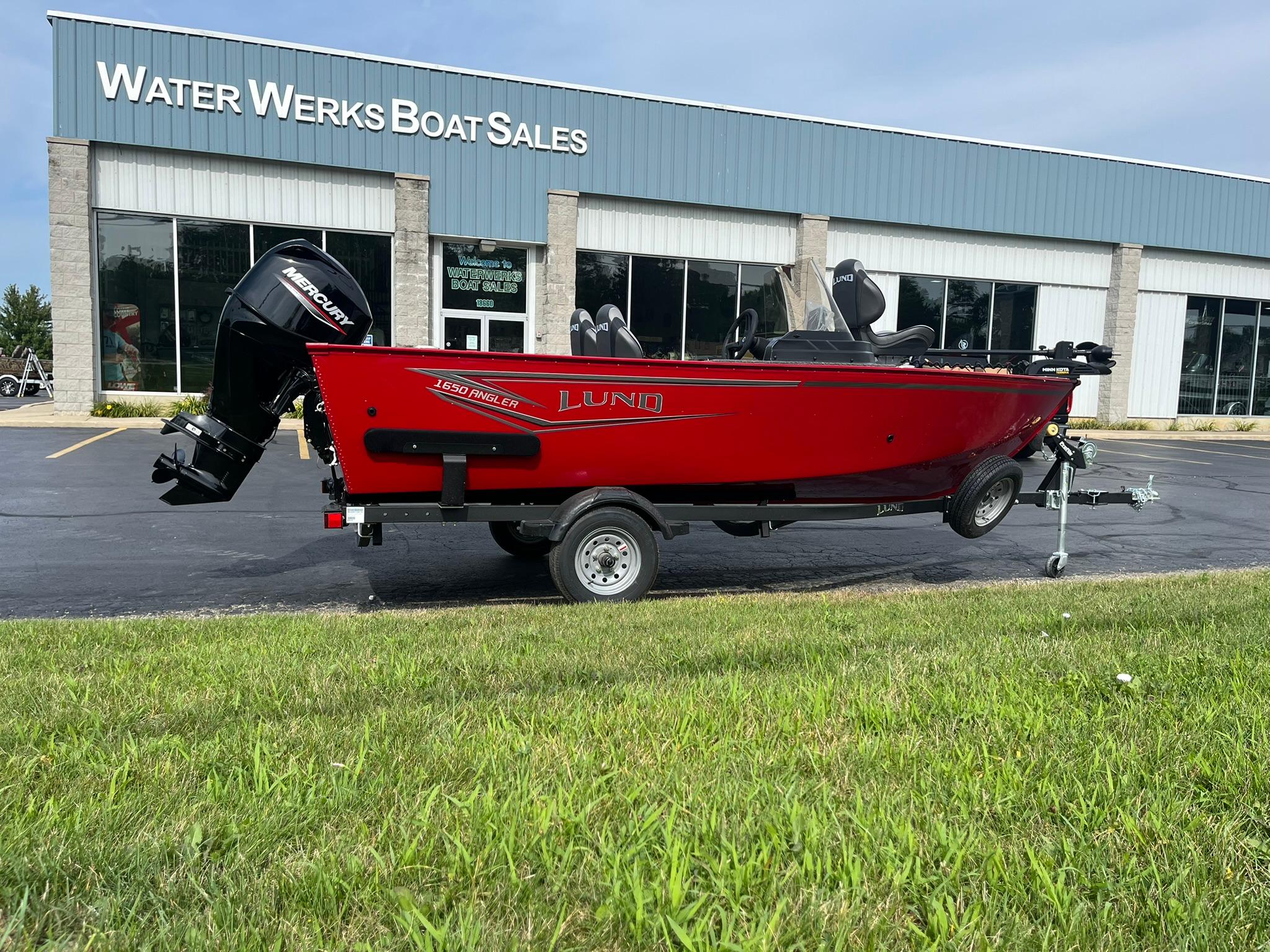 2026 Lund 1650 Angler SS boat in red, parked at Water Werks Boat Sales.