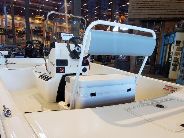 2023 Mako Pro Skiff 17 CC center console boat interior with seating and steering wheel.