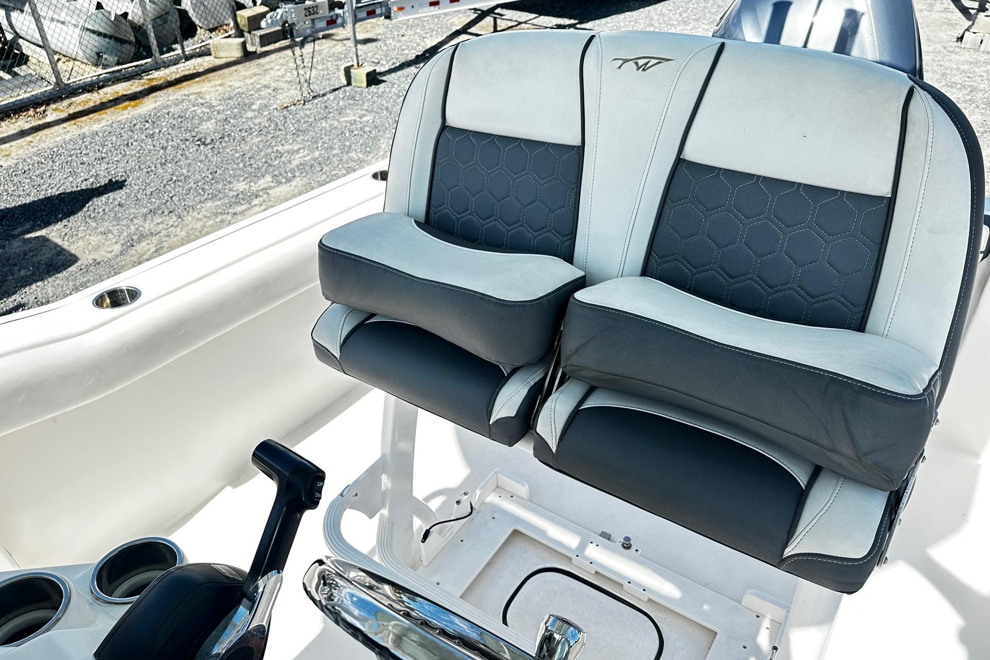 2020 Tidewater 230 CC Adventure boat seats with black and white upholstery.