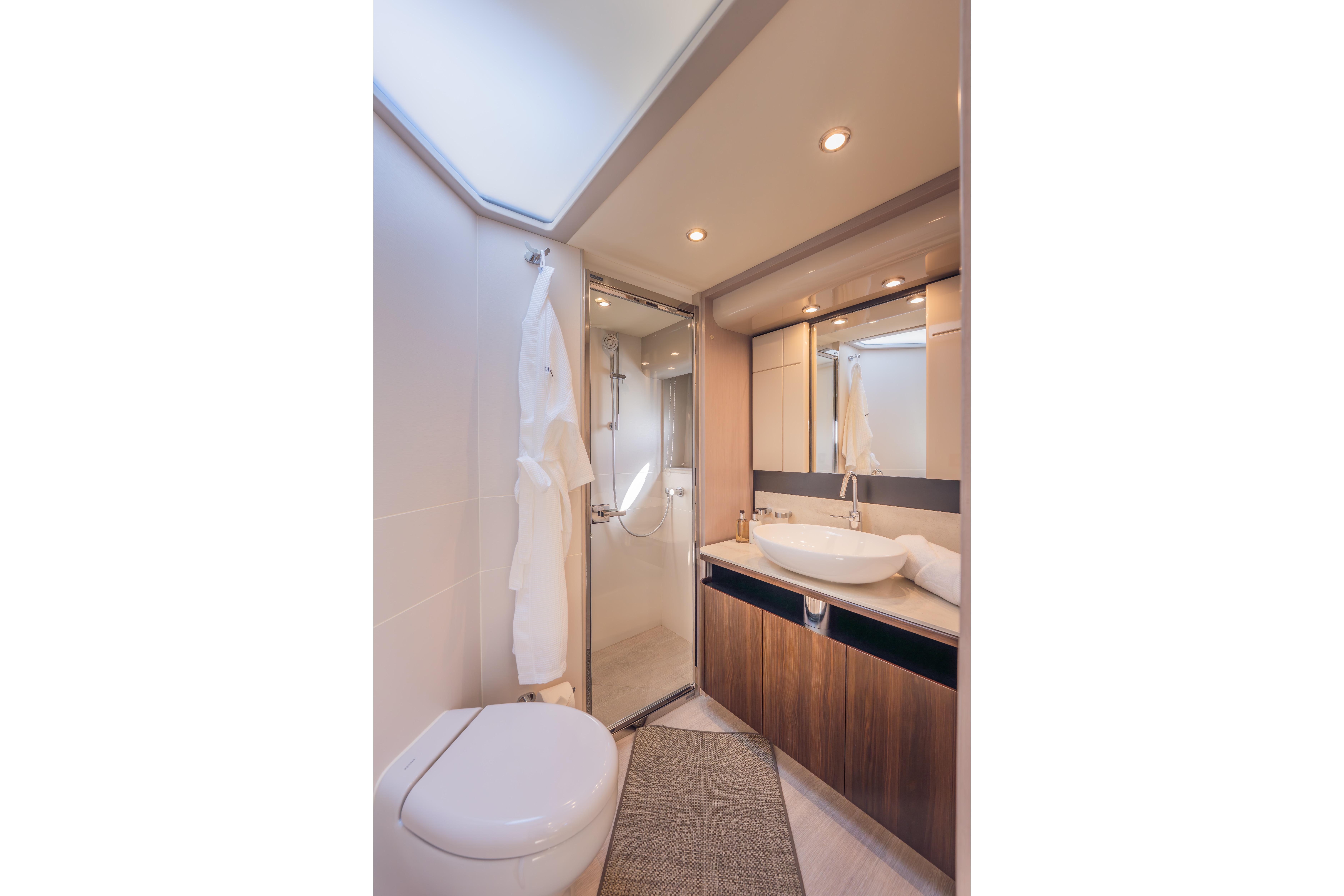 Luxurious bathroom in 2019 Absolute 58 FLY yacht with modern fixtures and elegant design.