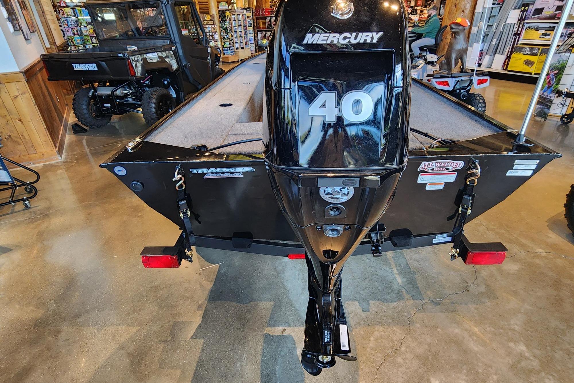 2026 Tracker Panfish 17 boat with Mercury 40 engine displayed indoors.
