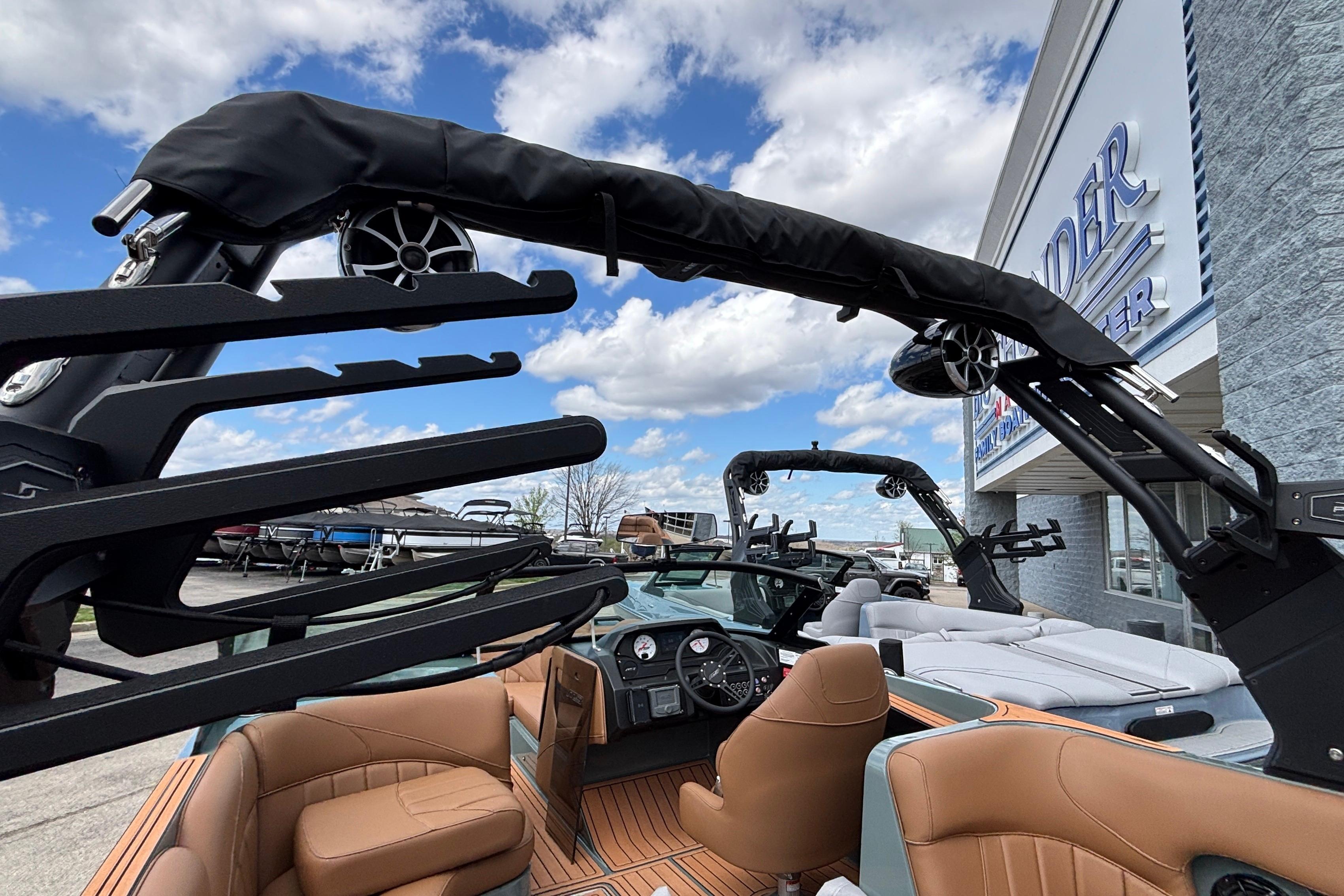 2026 MB B52 23 Classic boat interior with tan seats and modern audio system.