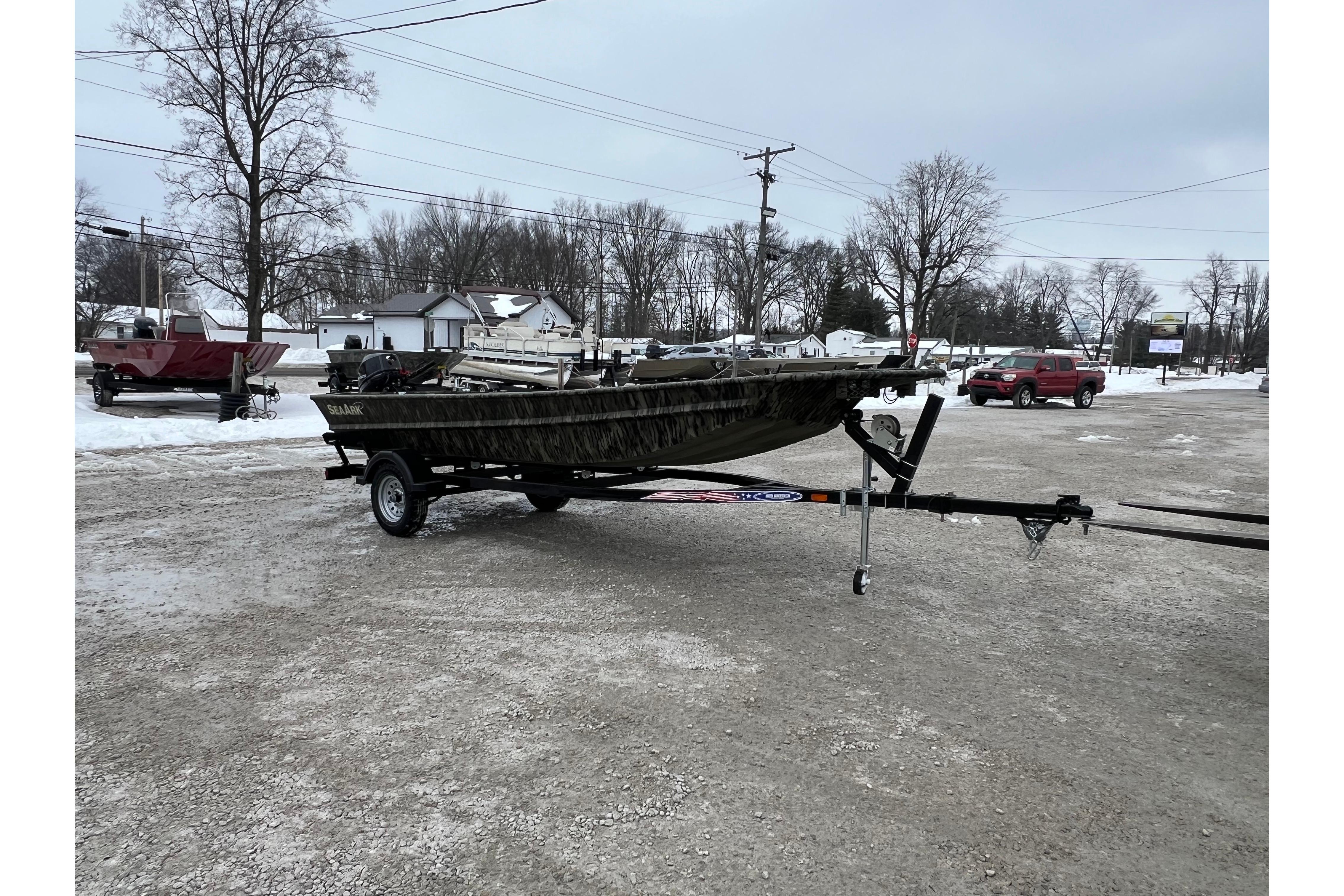2026 SeaArk 1648 MV Special boat on trailer in snowy parking lot.