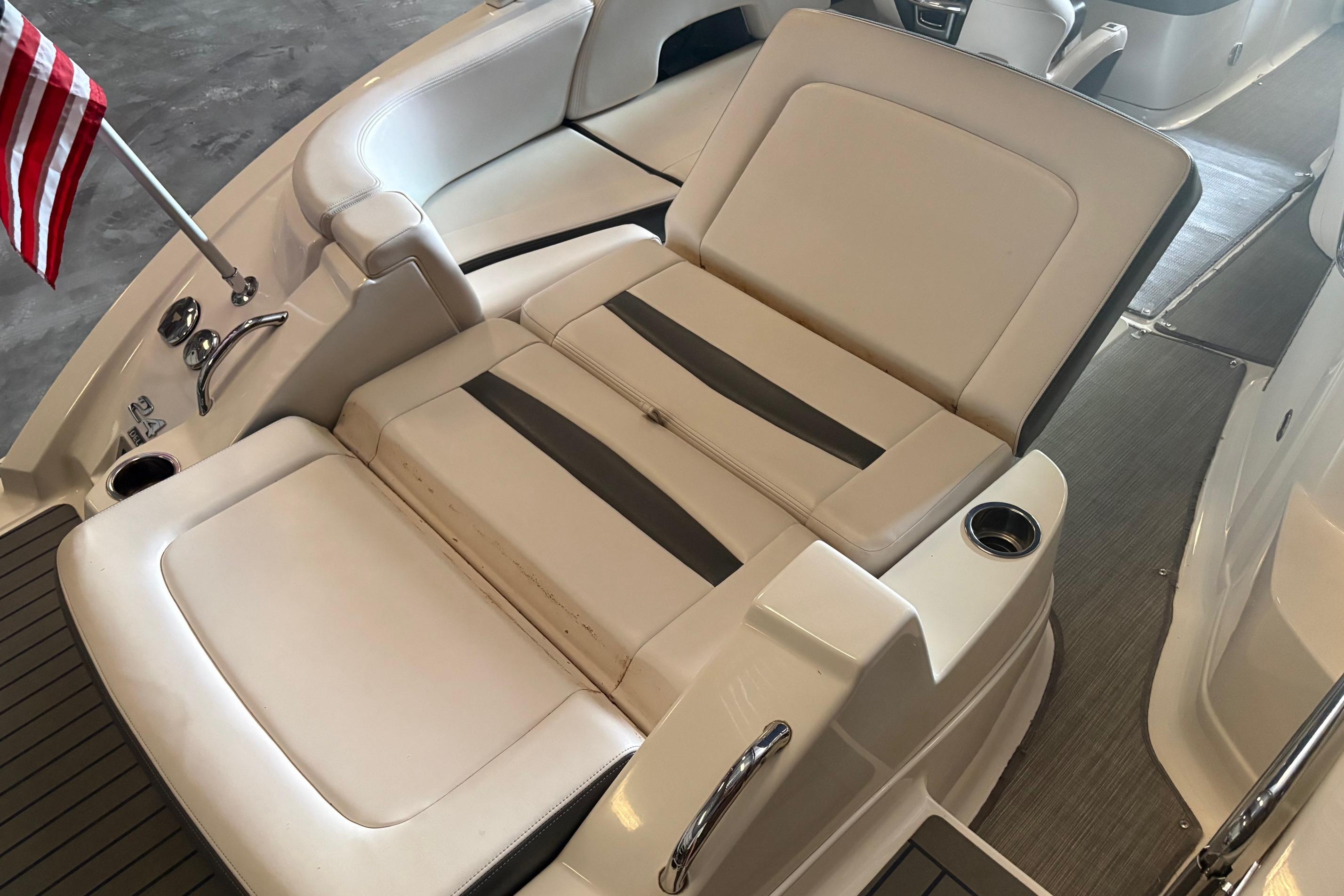2016 Chaparral 244 Sunesta boat interior with seating and American flag.