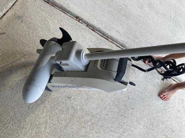 MotorGuide trolling motor on concrete, associated with 2011 Carolina Skiff 258 DLV.