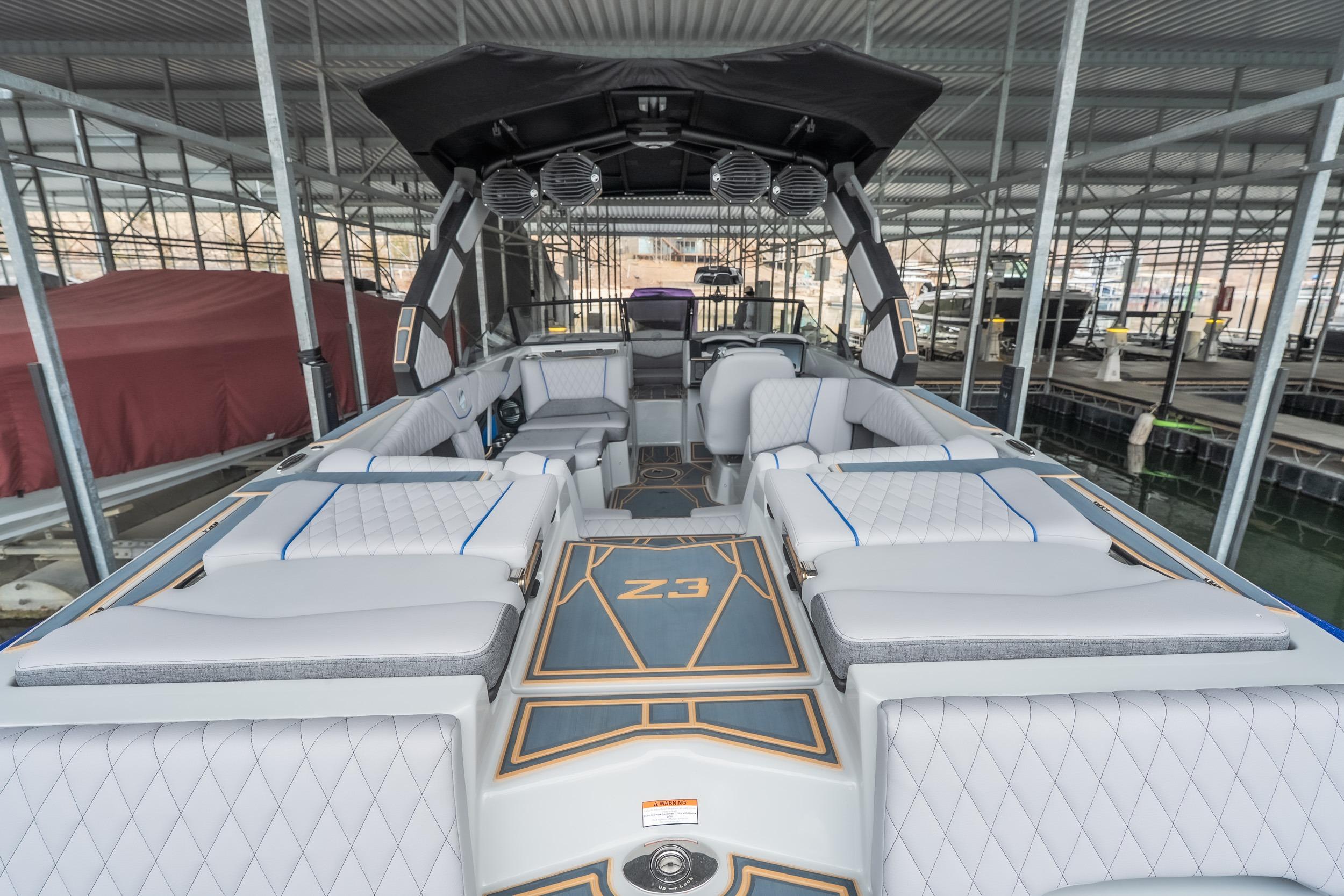2026 Tigé Z3 boat interior with luxurious seating and modern design in a marina setting.