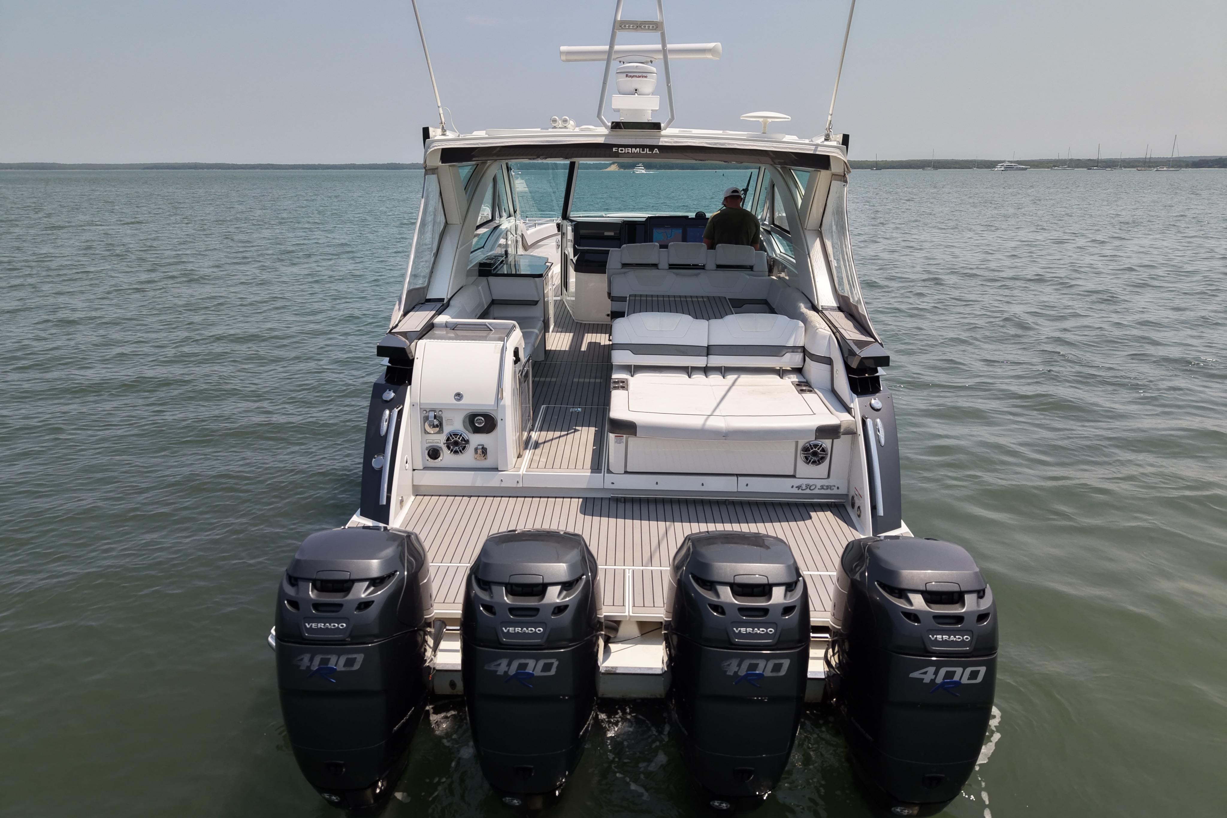 2019 Formula 430 Super Sport Crossover with four powerful outboard engines on open water.