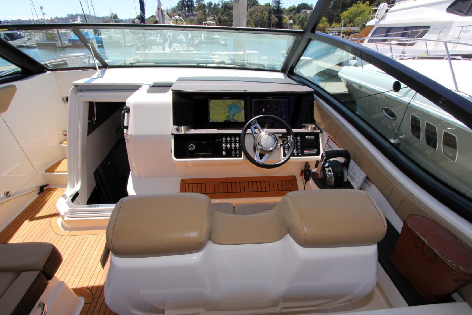 2021 Sea Ray Sundancer 320 Outboard helm with modern controls and navigation system.