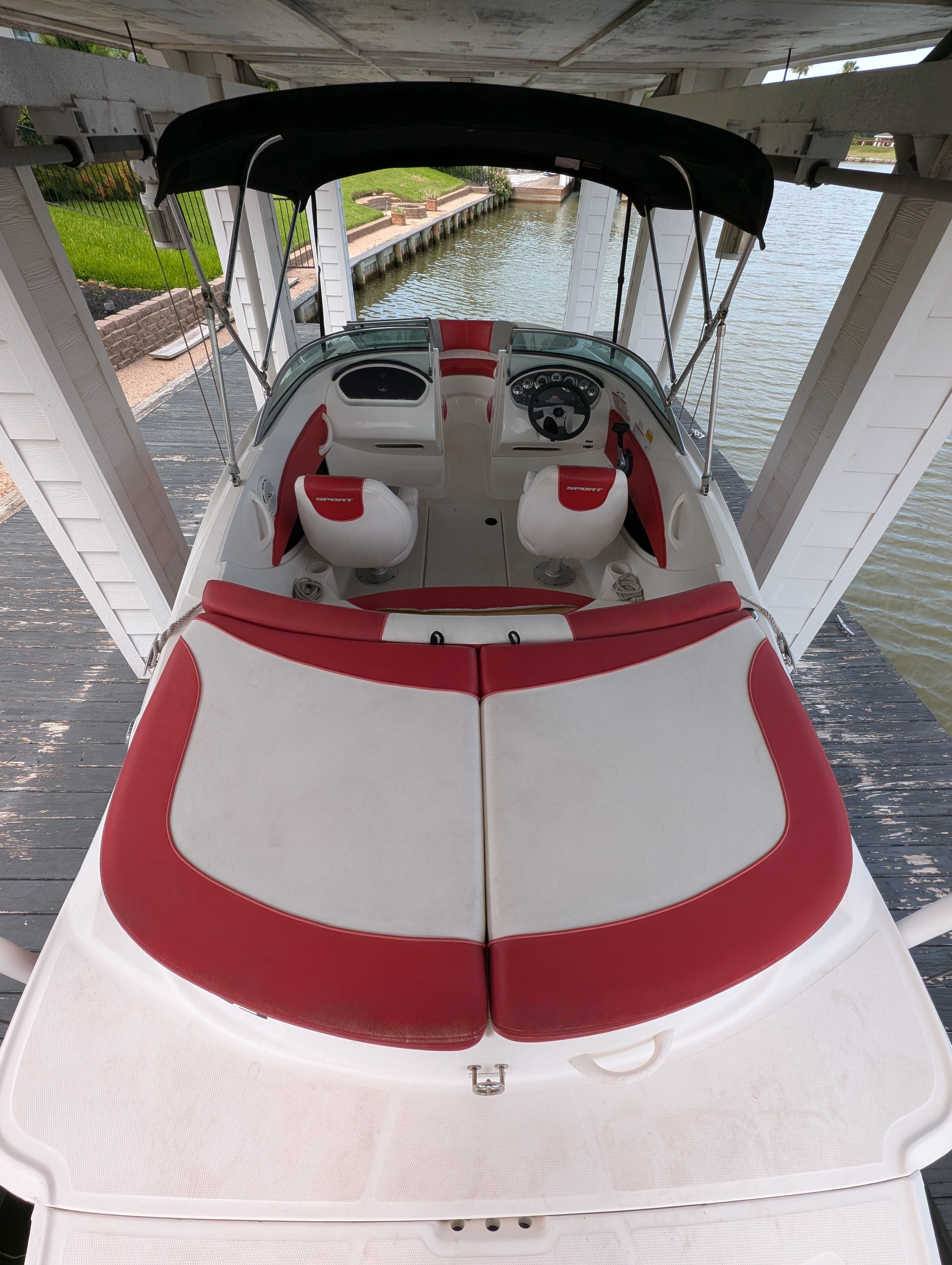 2011 Sea Ray 185 Sport boat with red and white interior.
