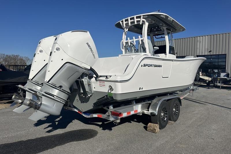 2026 Sportsman Open 282 Center Console boat on trailer, dual Mercury engines.