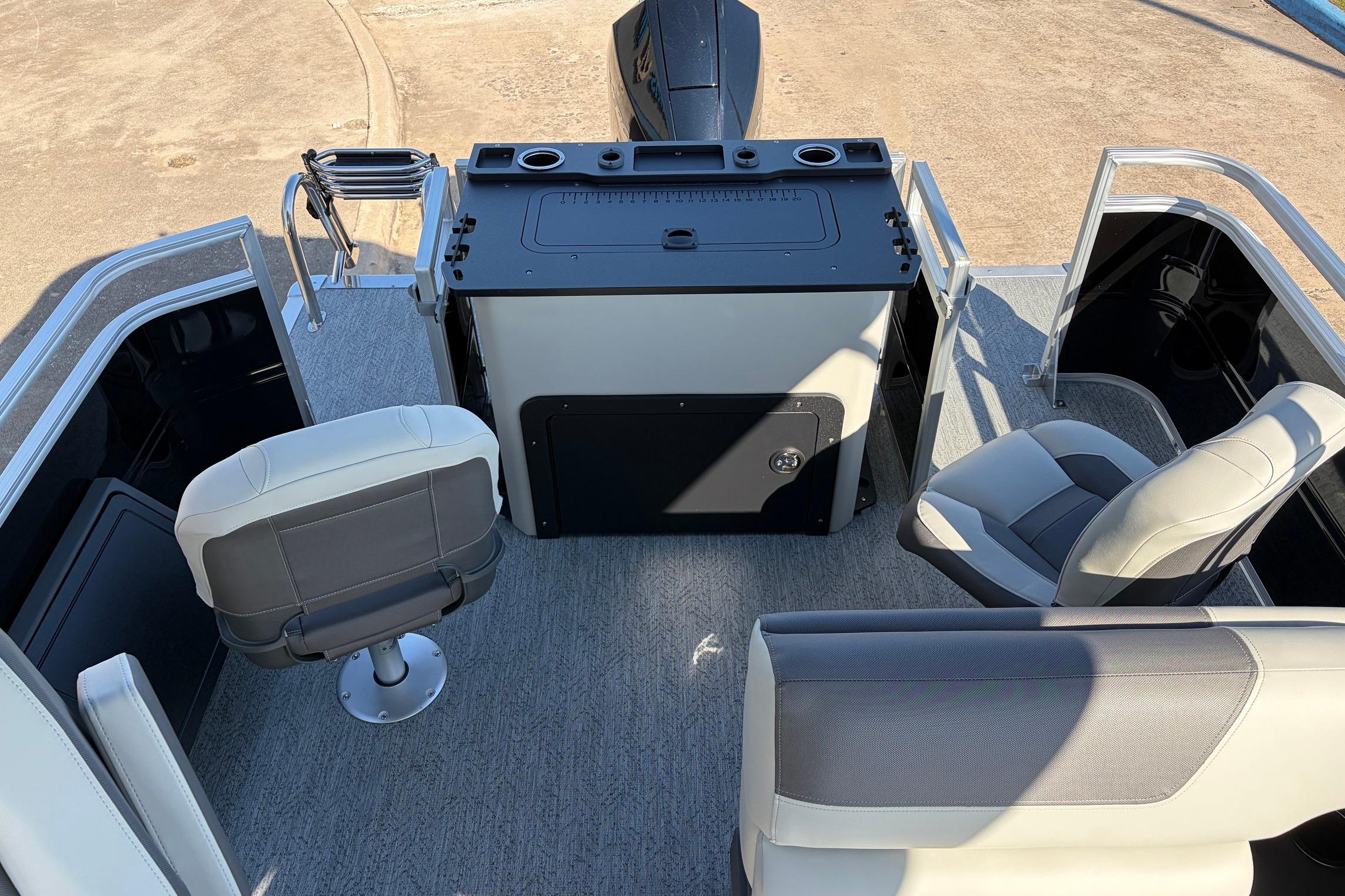 2026 Sun Tracker Fishin' Barge 22 XP3 interior with seating and control console.