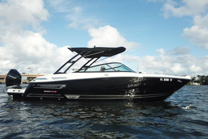 2022 Monterey 255SS Super Sport boat on water under blue sky.