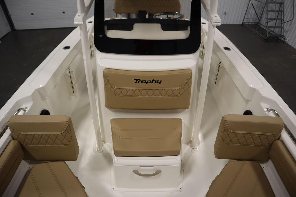 2026 Bayliner Trophy T20CC boat interior with tan cushioned seating and white deck.