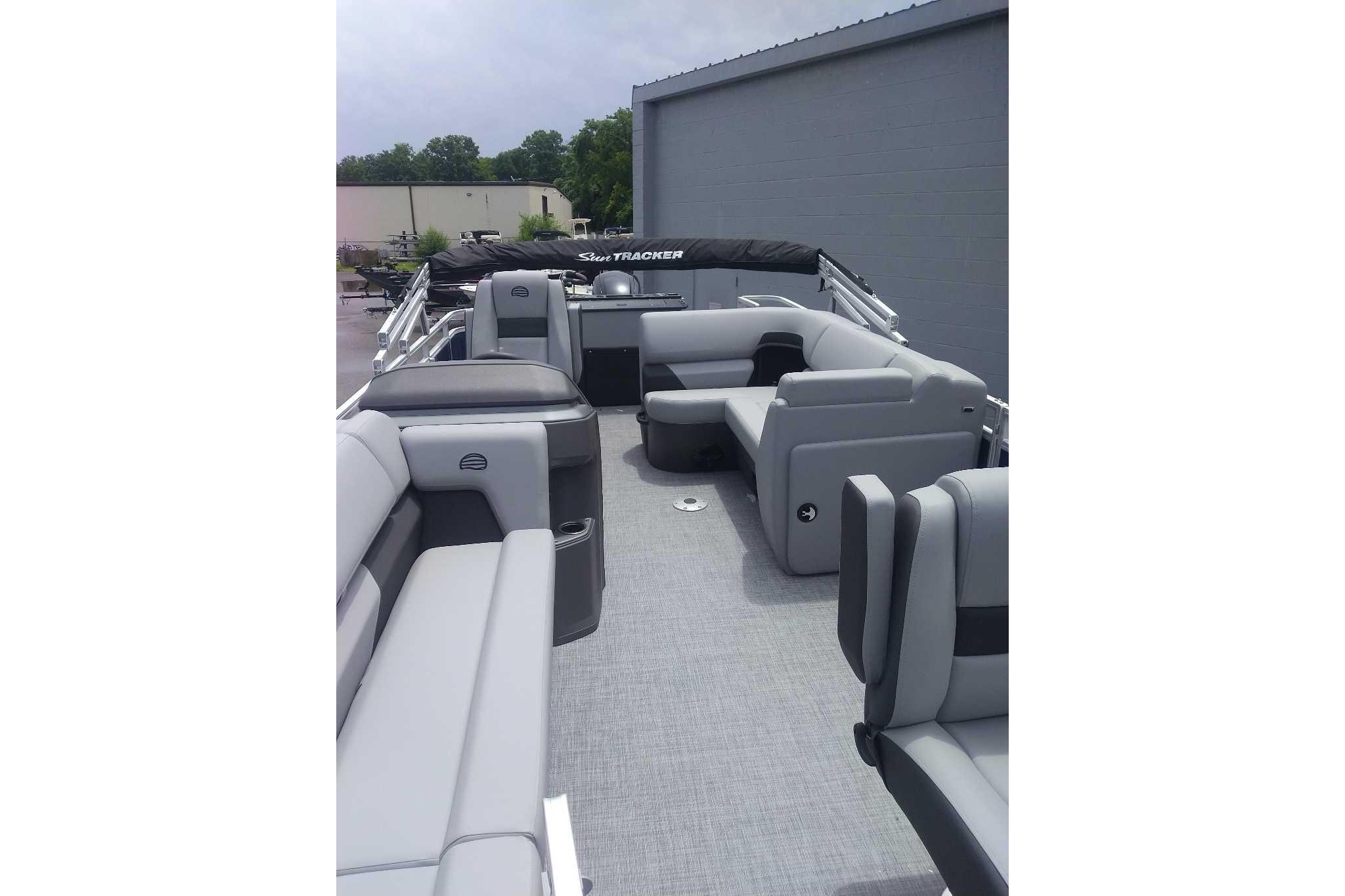 2026 Sun Tracker SportFish 20 DLX pontoon boat with spacious seating and modern design.