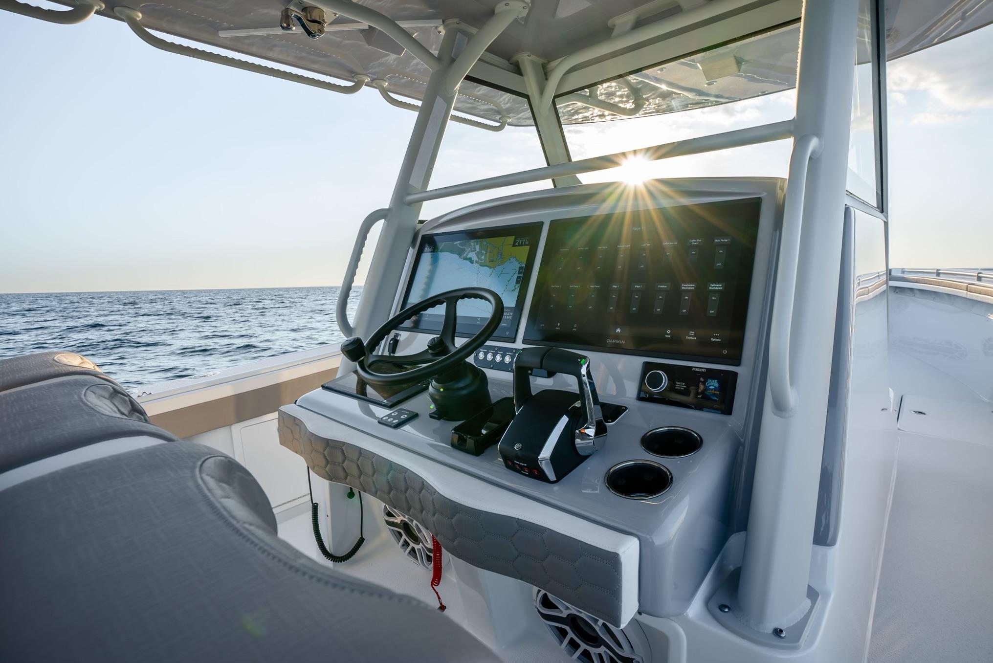 2024 Yellowfin 39 boat dashboard with ocean view at sunset.