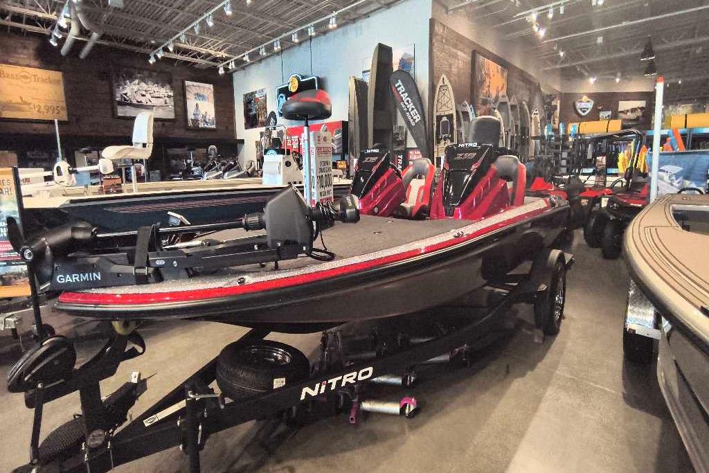 2026 Nitro Z18 Pro boat in showroom, featuring Garmin equipment and sleek design.
