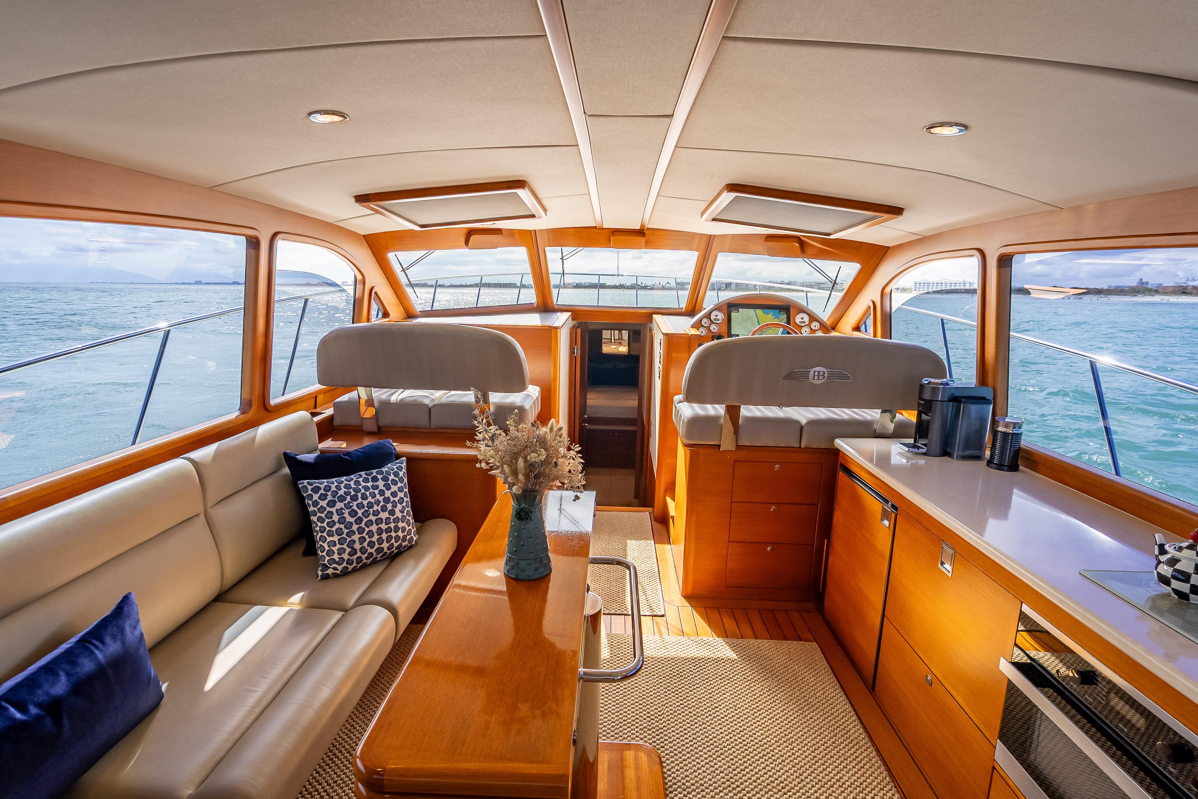 Luxurious interior of 2018 Palm Beach Motor Yachts PB50 with elegant seating and ocean view.