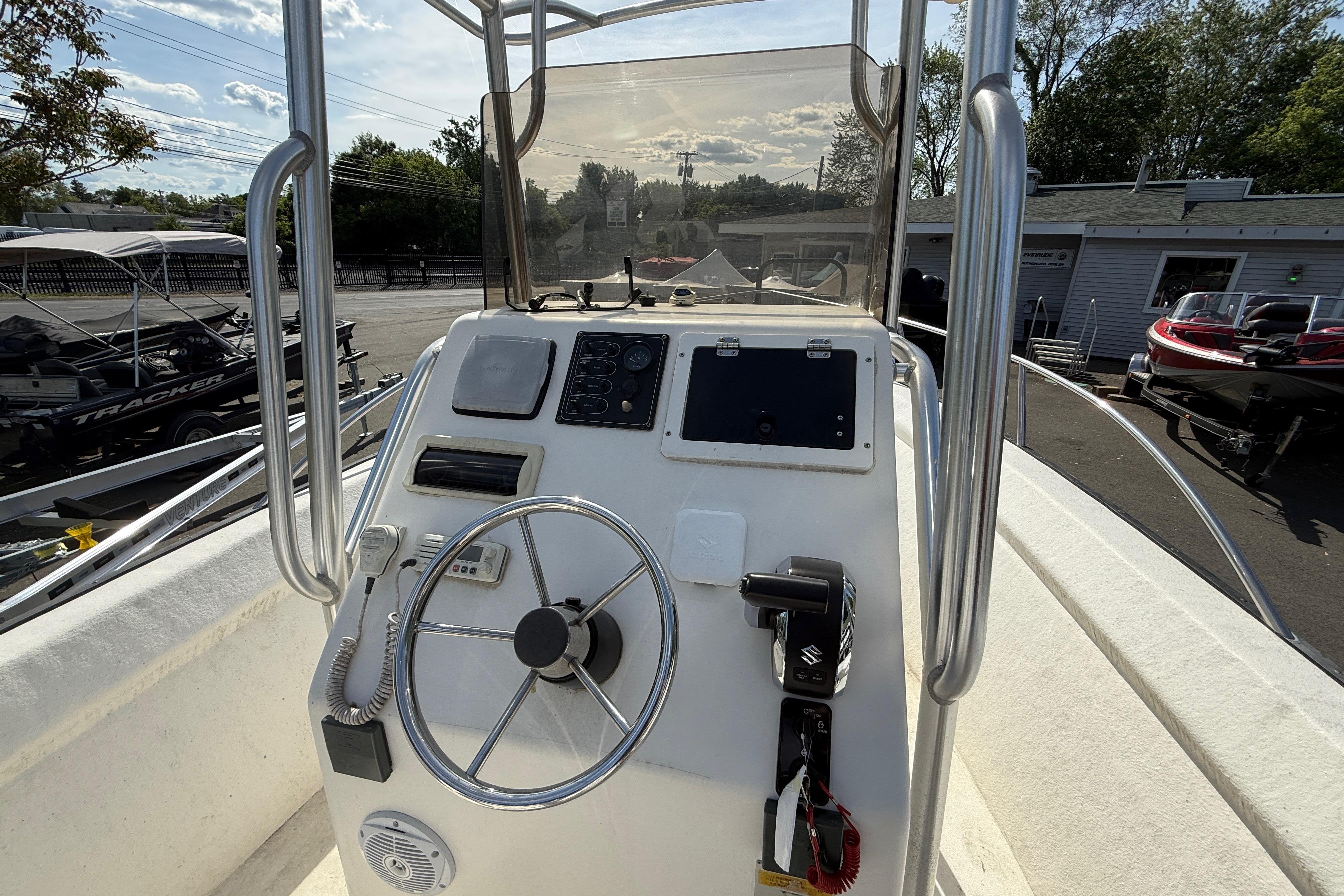 2008 Key Largo 206 Center Console boat dashboard with steering wheel and controls.