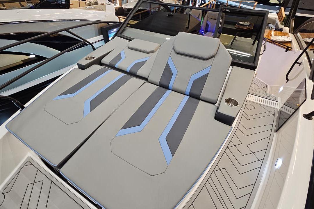 2026 Hanover 327 boat with sleek gray and blue seating design.