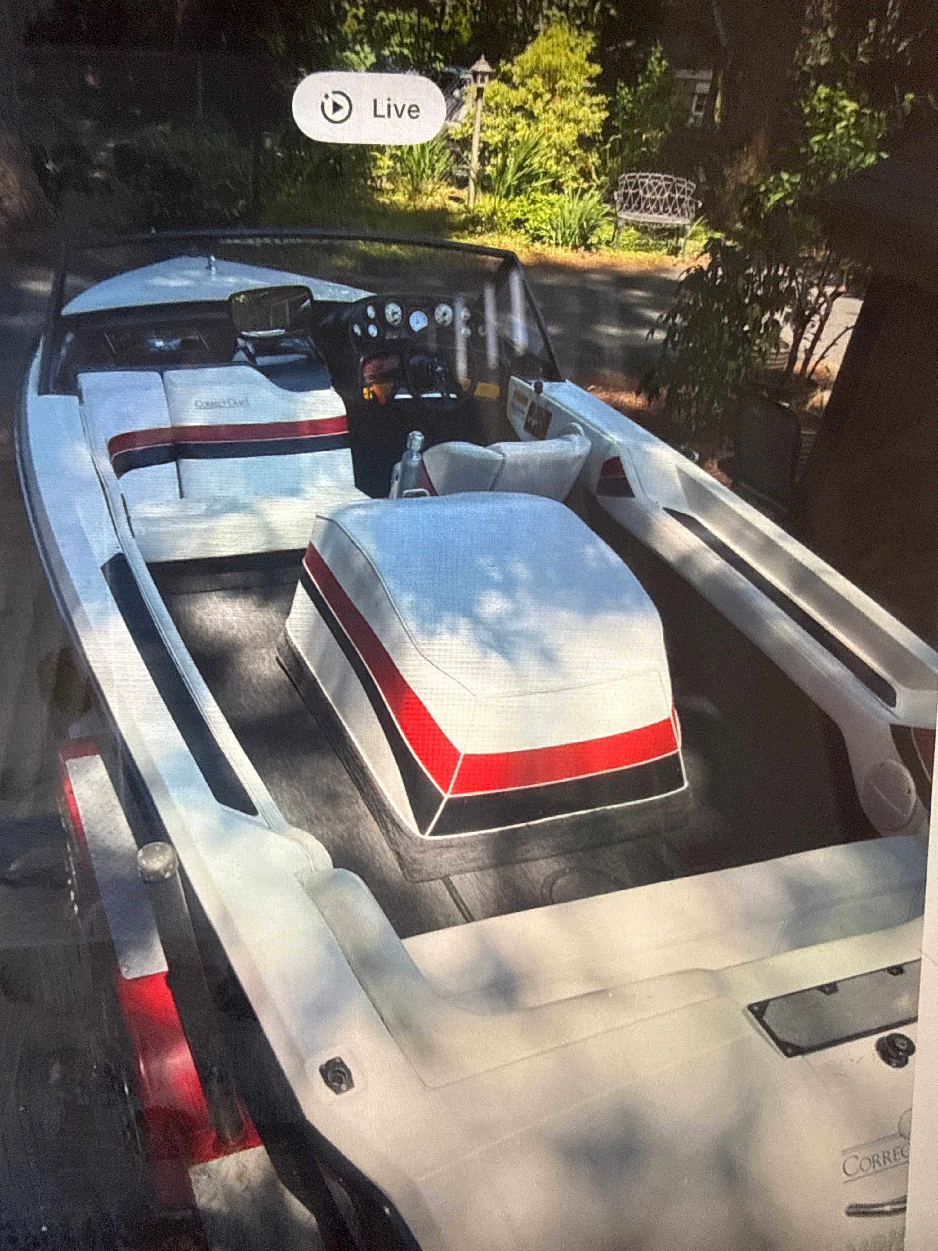 1990 Correct Craft Ski Nautique boat interior with red and white upholstery.