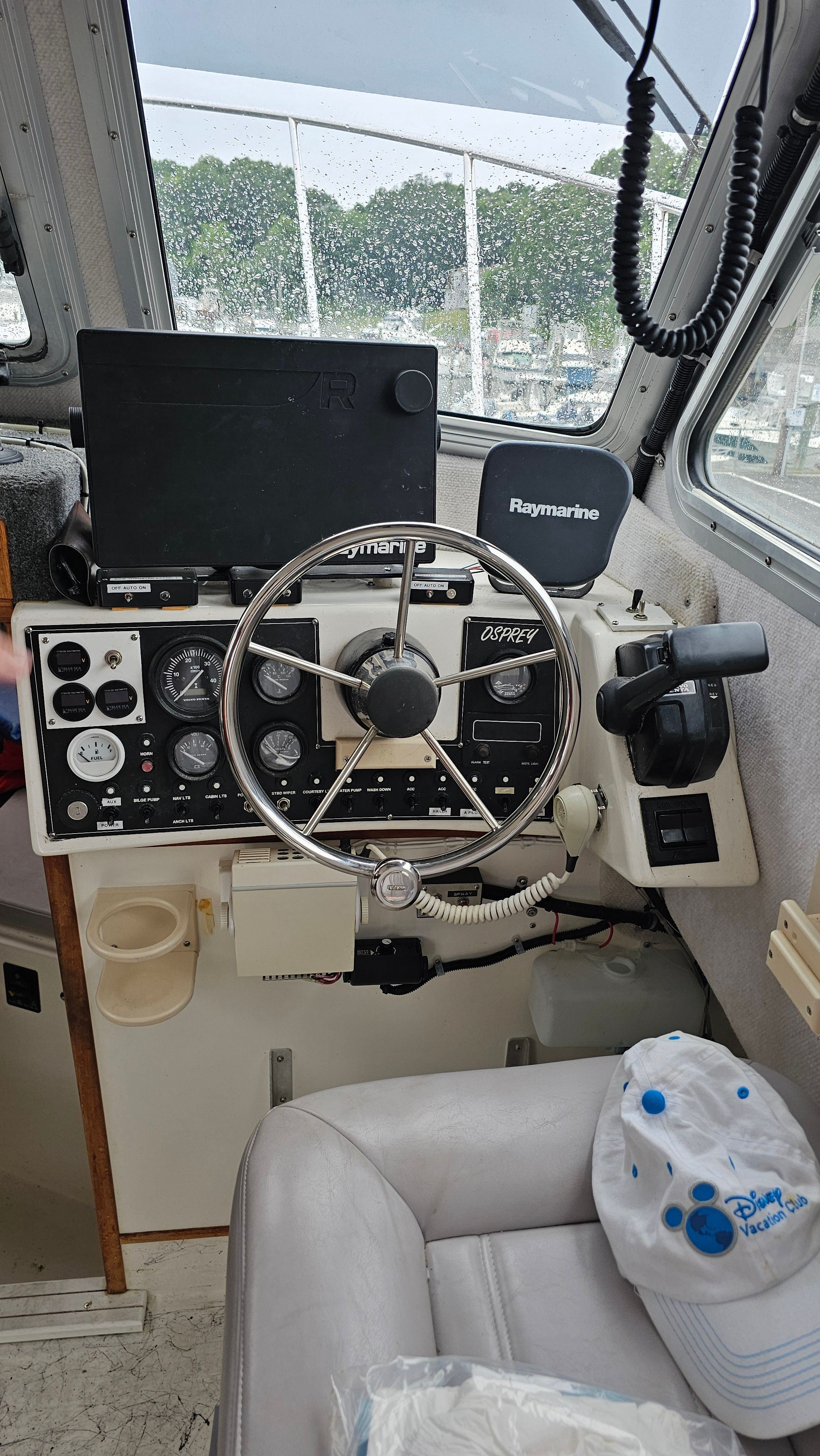 2004 Osprey 26 Expedition boat cockpit with steering wheel.