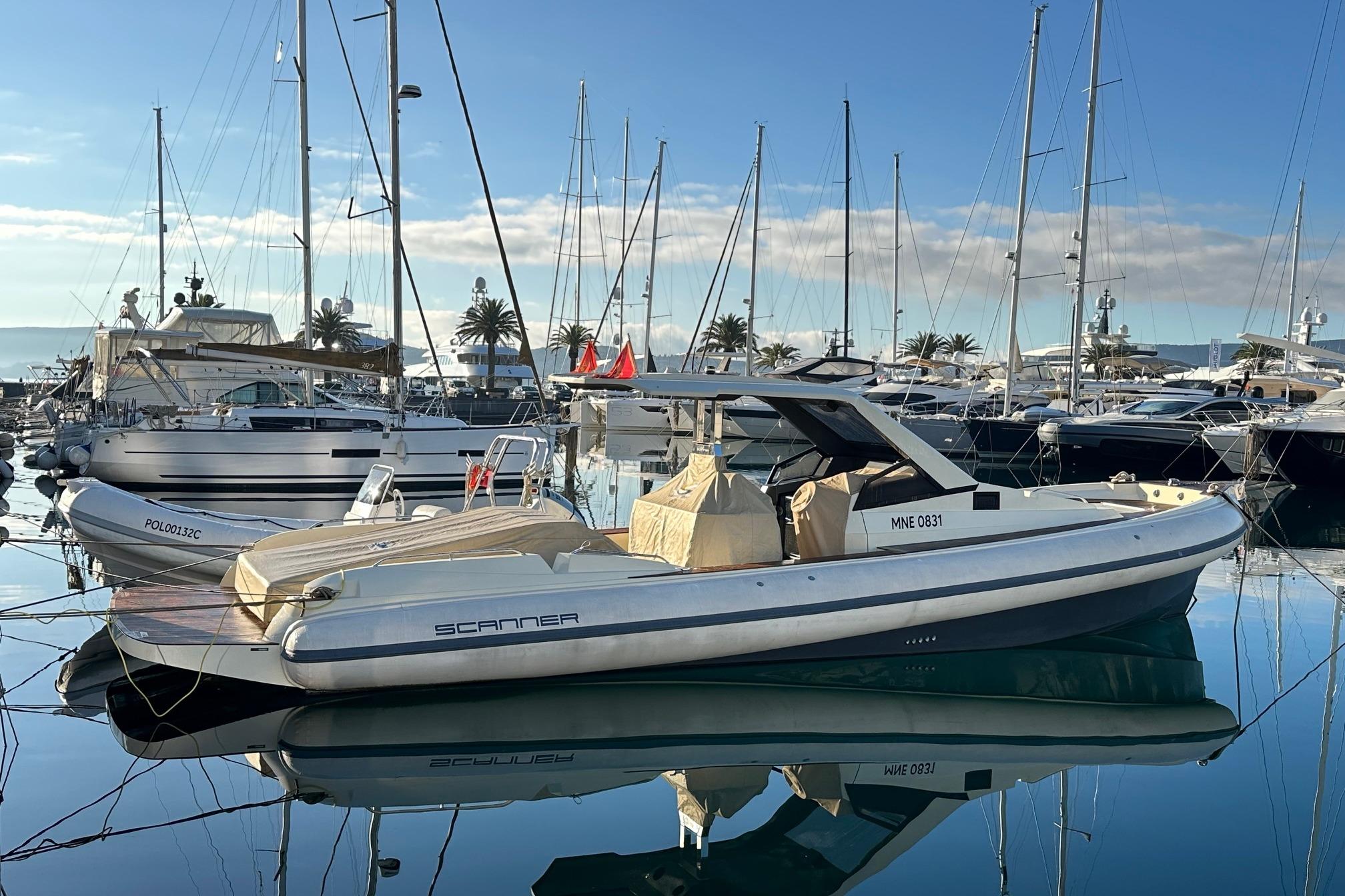 Luxury Scanner Envy 1200 boat docked in a serene marina, 2022 model.
